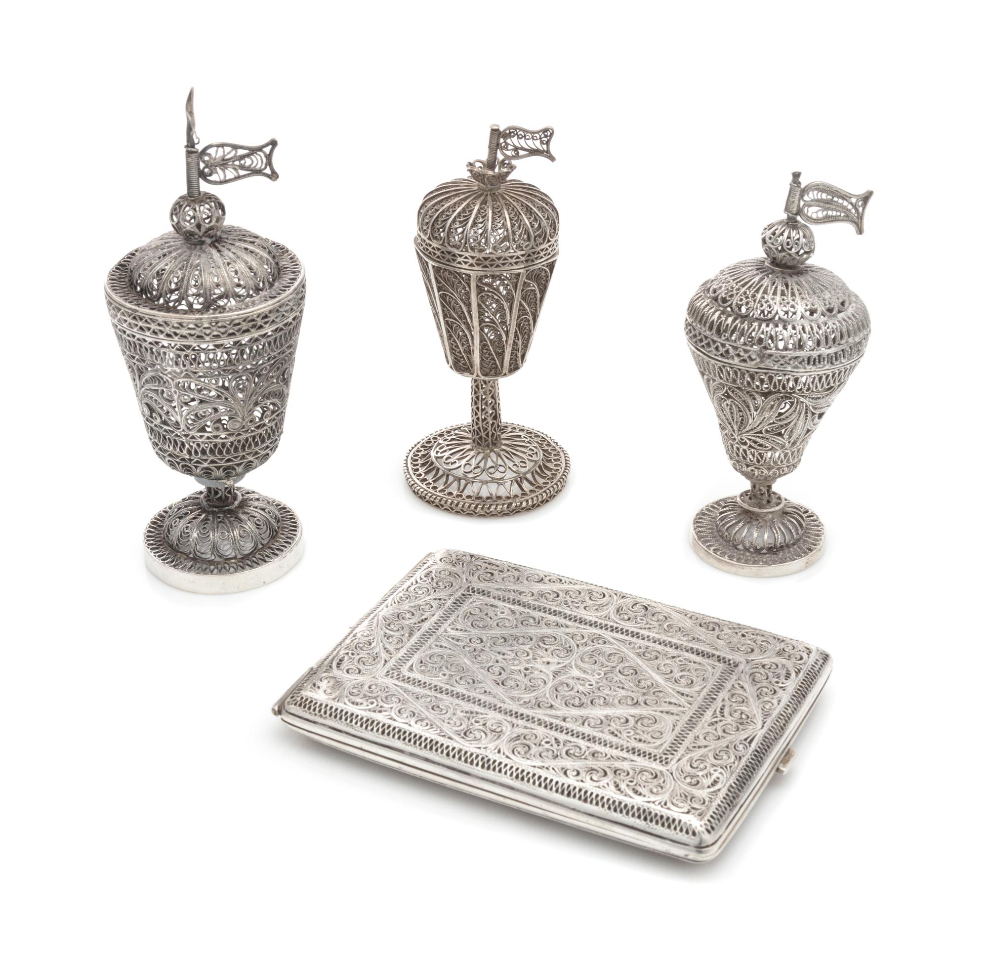 A Group of Four Middle Eastern Silver Filigree Objects, , comprising three spice towers and a cigarette case.