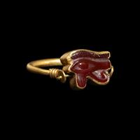An Egyptian Carnelian Wadjet — Set in a gold swivel ring
