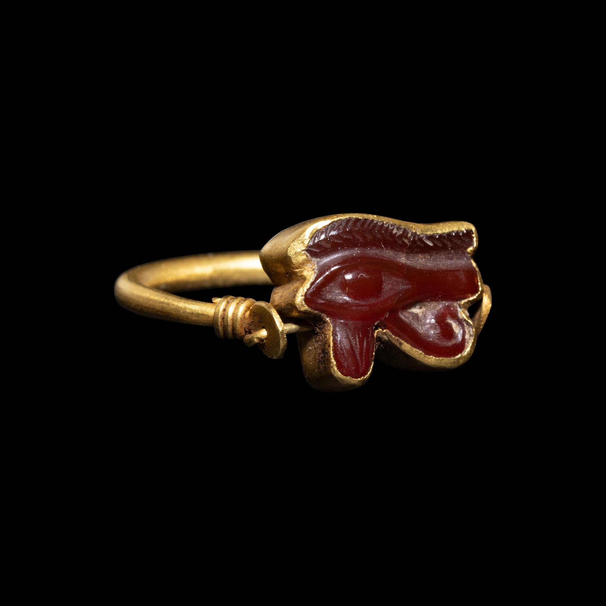 An Egyptian Carnelian Wadjet — Set in a gold swivel ring