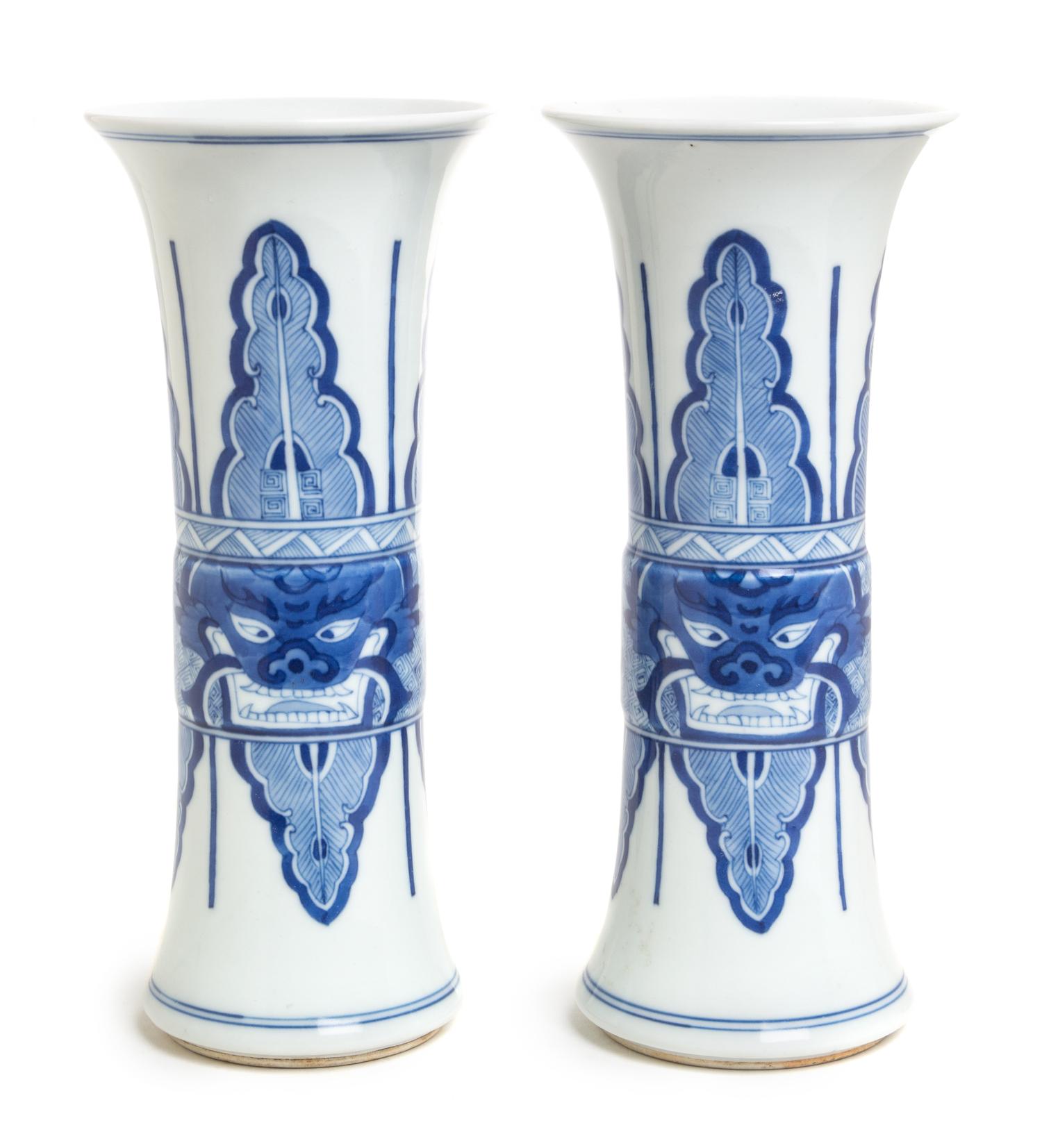 A Pair of Blue and White Porcelain Gu Vases Height of each 9 inches.