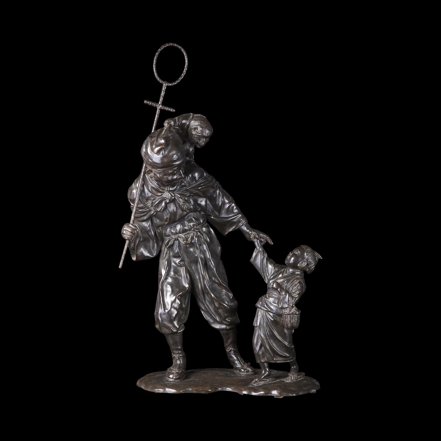 A Japanese Tokyo School Patinated Bronze Monkey Trainer Figural Group, Meiji/Taisho Period