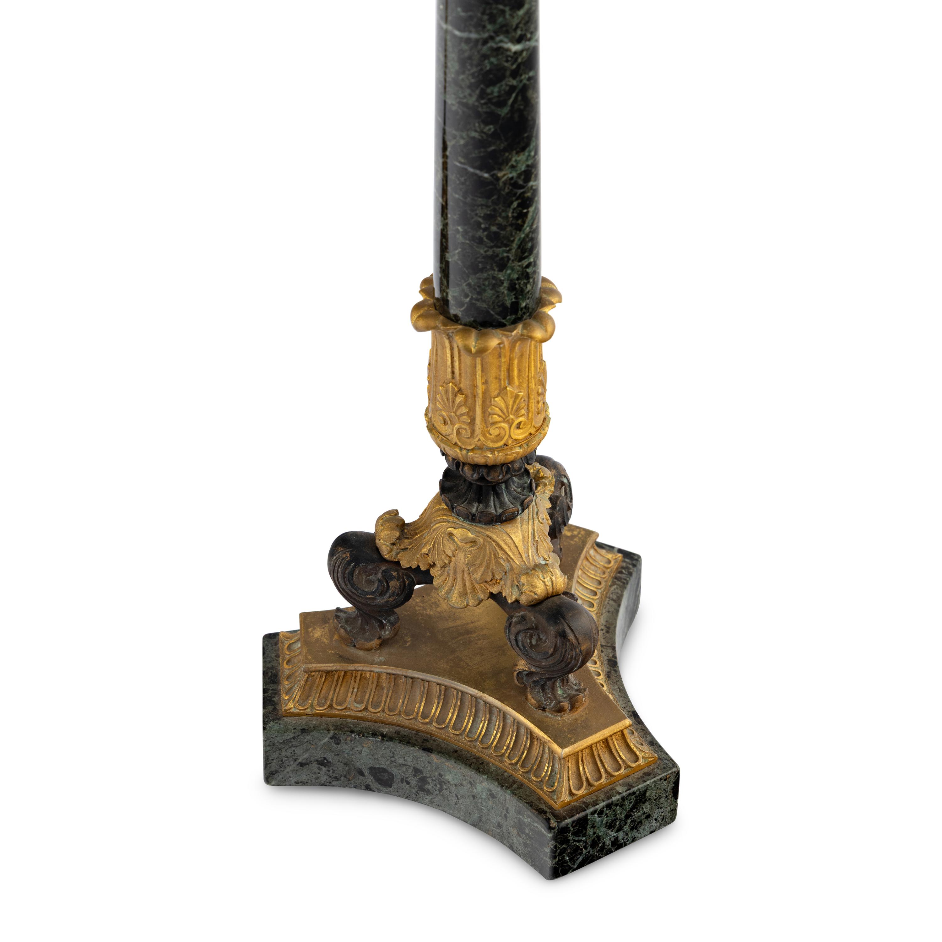 A Pair of Charles X Gilt and Patinated Bronze Mounted Marble Seven-Light Candelabra