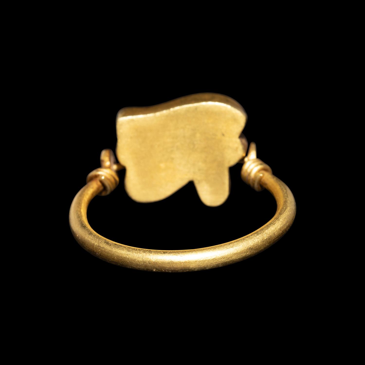 An Egyptian Carnelian Wadjet — Set in a gold swivel ring