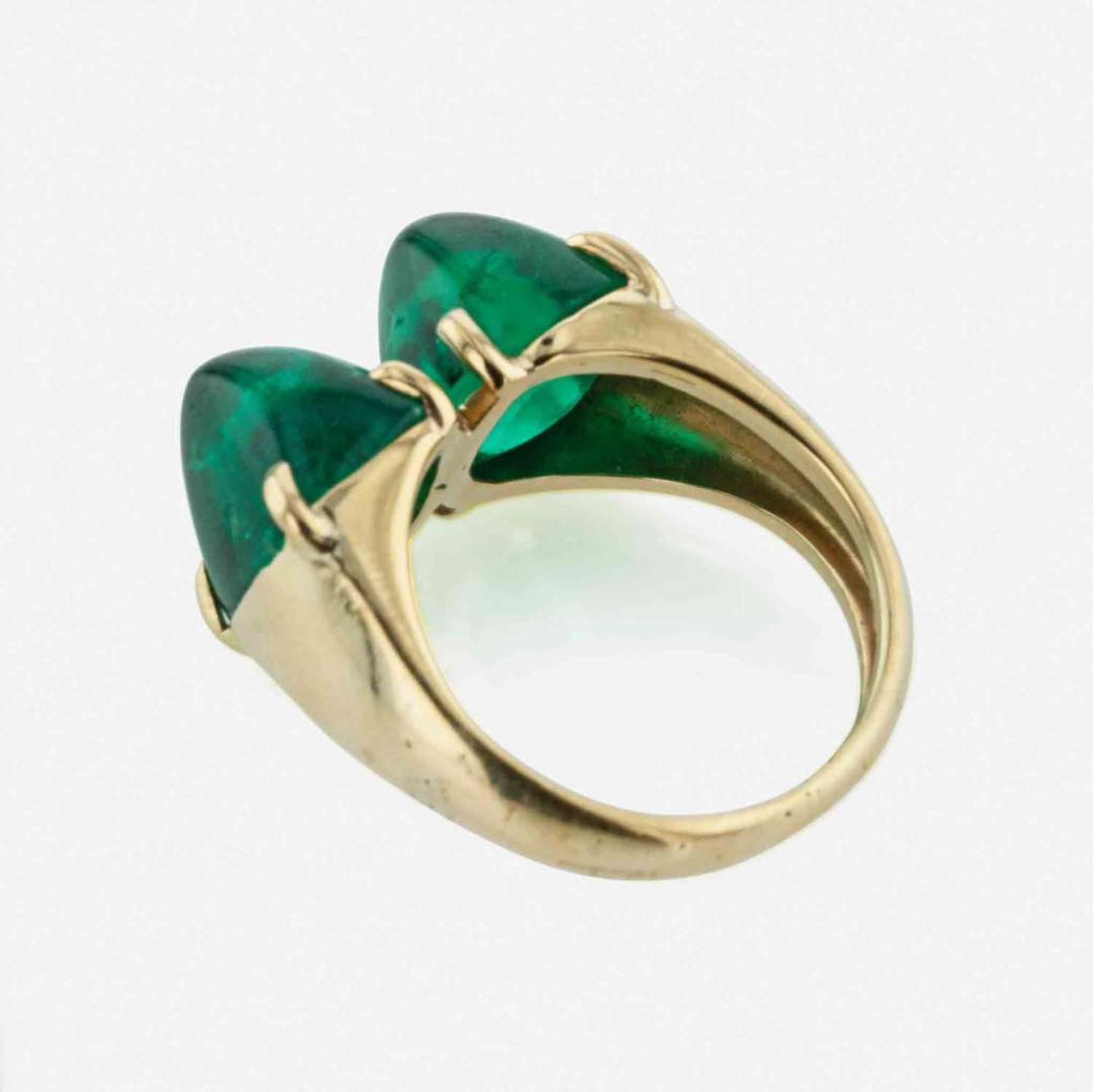 A Yellow Gold and Sugarloaf Emerald Ring