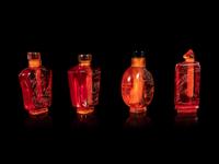 Four Chinese Amber Tone Glass Snuff Bottles
