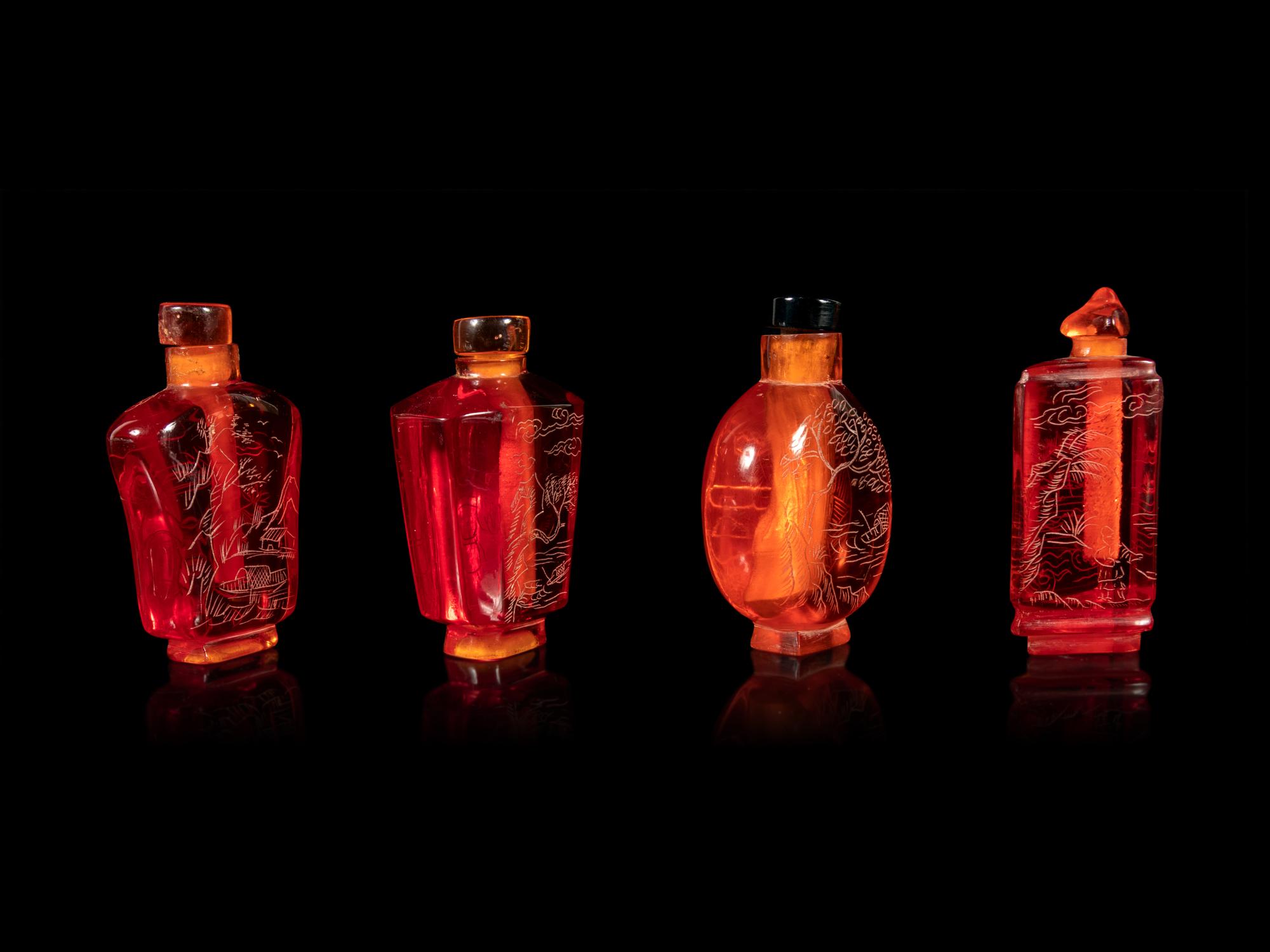 Four Chinese Amber Tone Glass Snuff Bottles