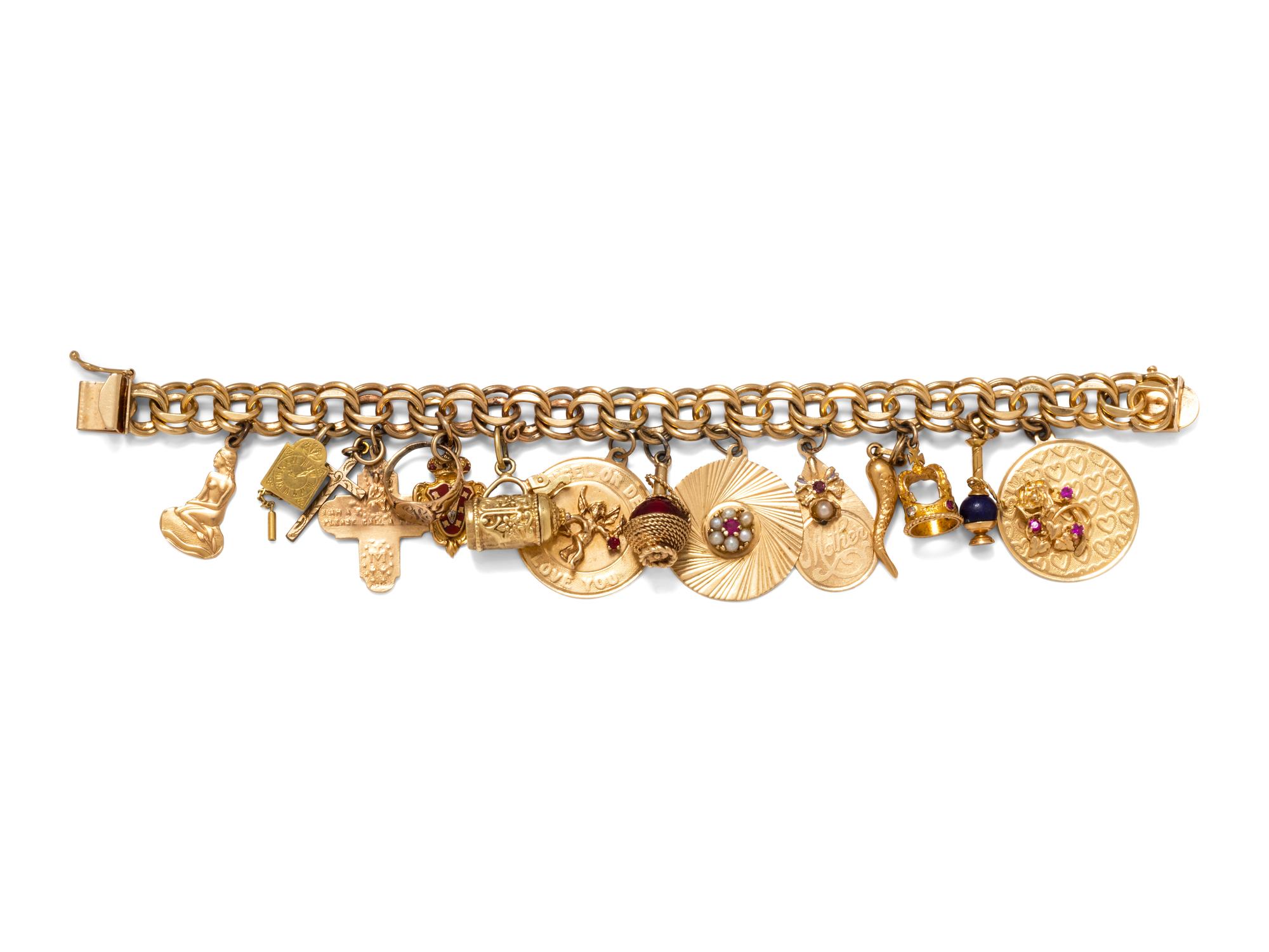 A 14 Karat Yellow Gold Charm Bracelet with 15 Attached Charms,