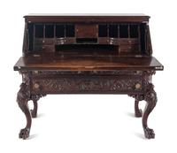 A Renaissance Revival Carved Mahogany Slant-Front Bureau