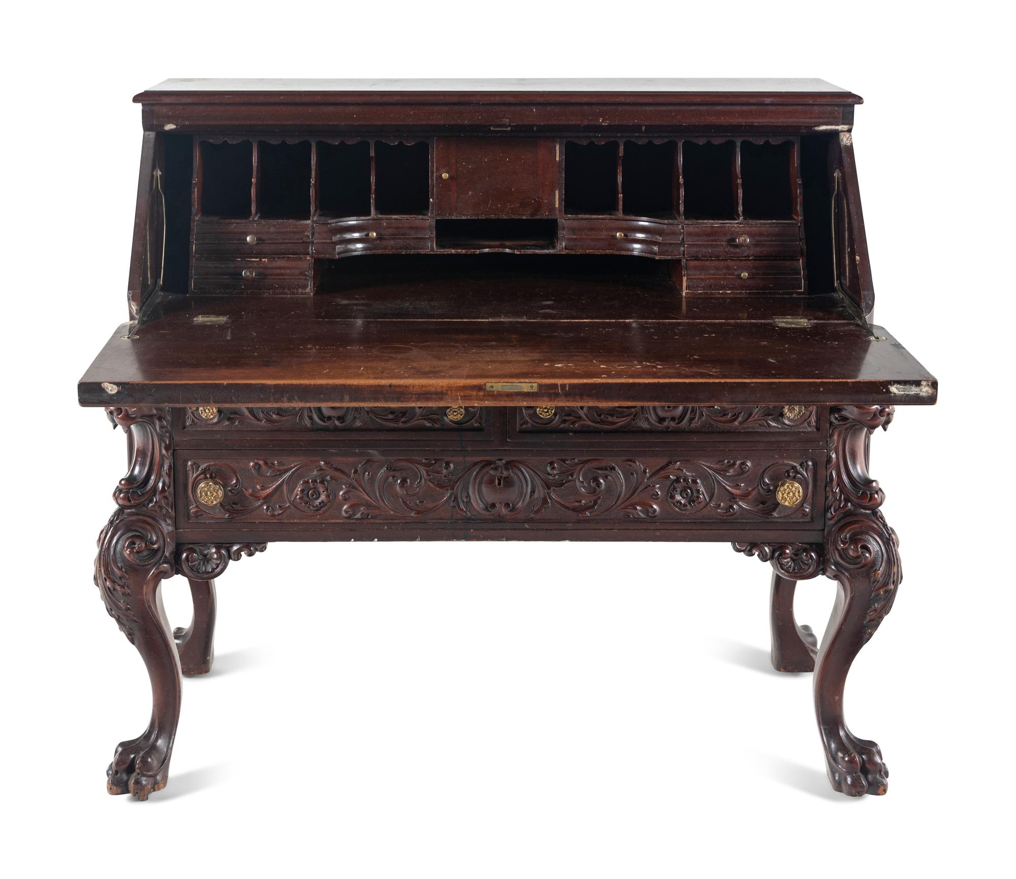 A Renaissance Revival Carved Mahogany Slant-Front Bureau