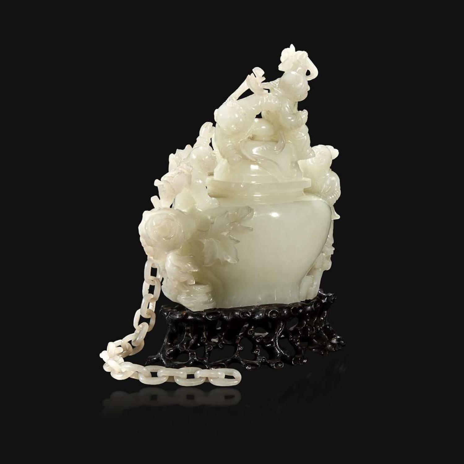 A Chinese carved white jade "Boys" vase and cover Qing Dynasty, 18th/early 19th Century