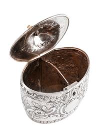 An English Silver Tea Caddy, John Schofield, London, 1794, the oval domed lid with a pinecone finial, the body bearing a vacant cartouc