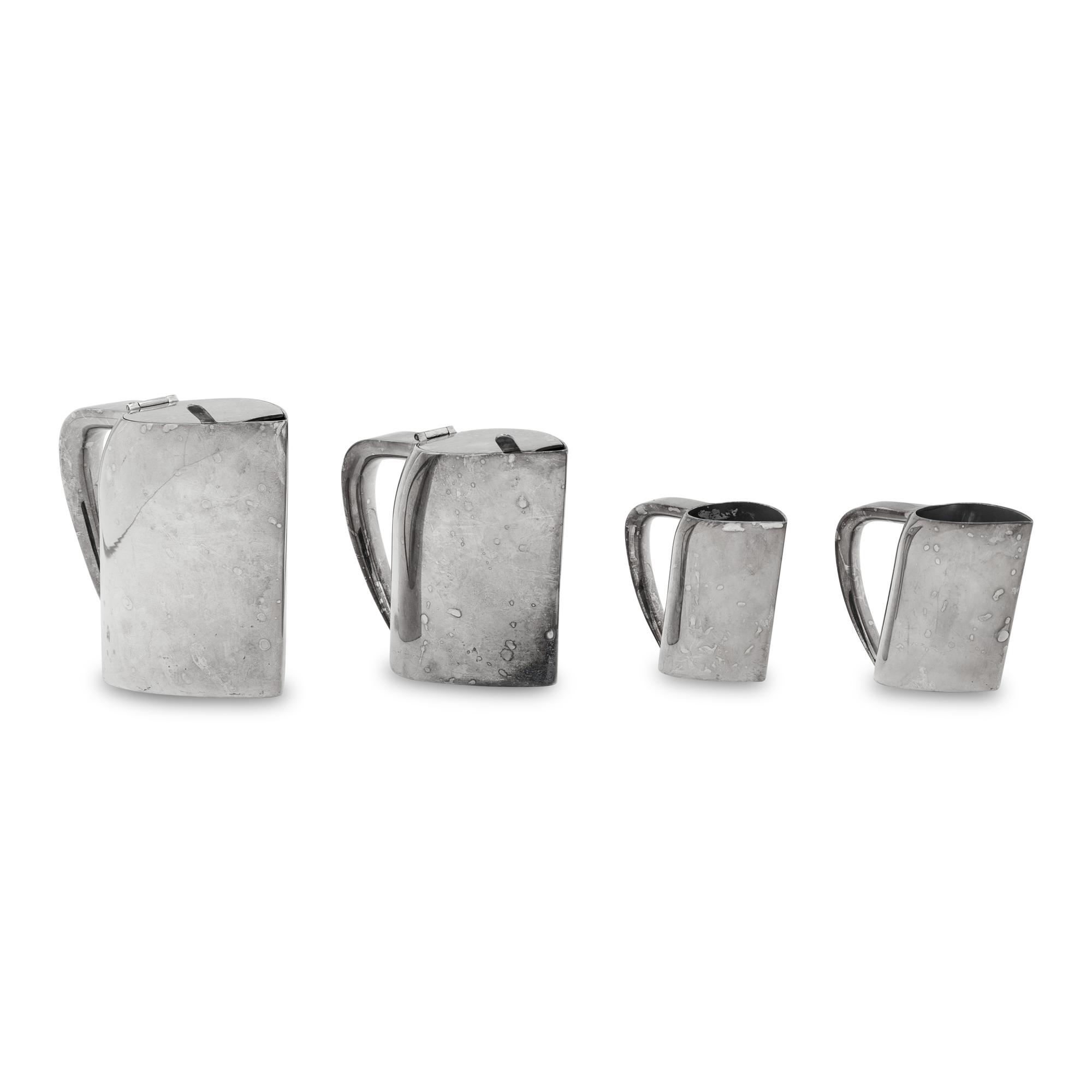 A Group of Four Ercuis Silver-Plate Milk or Cream Pitchers