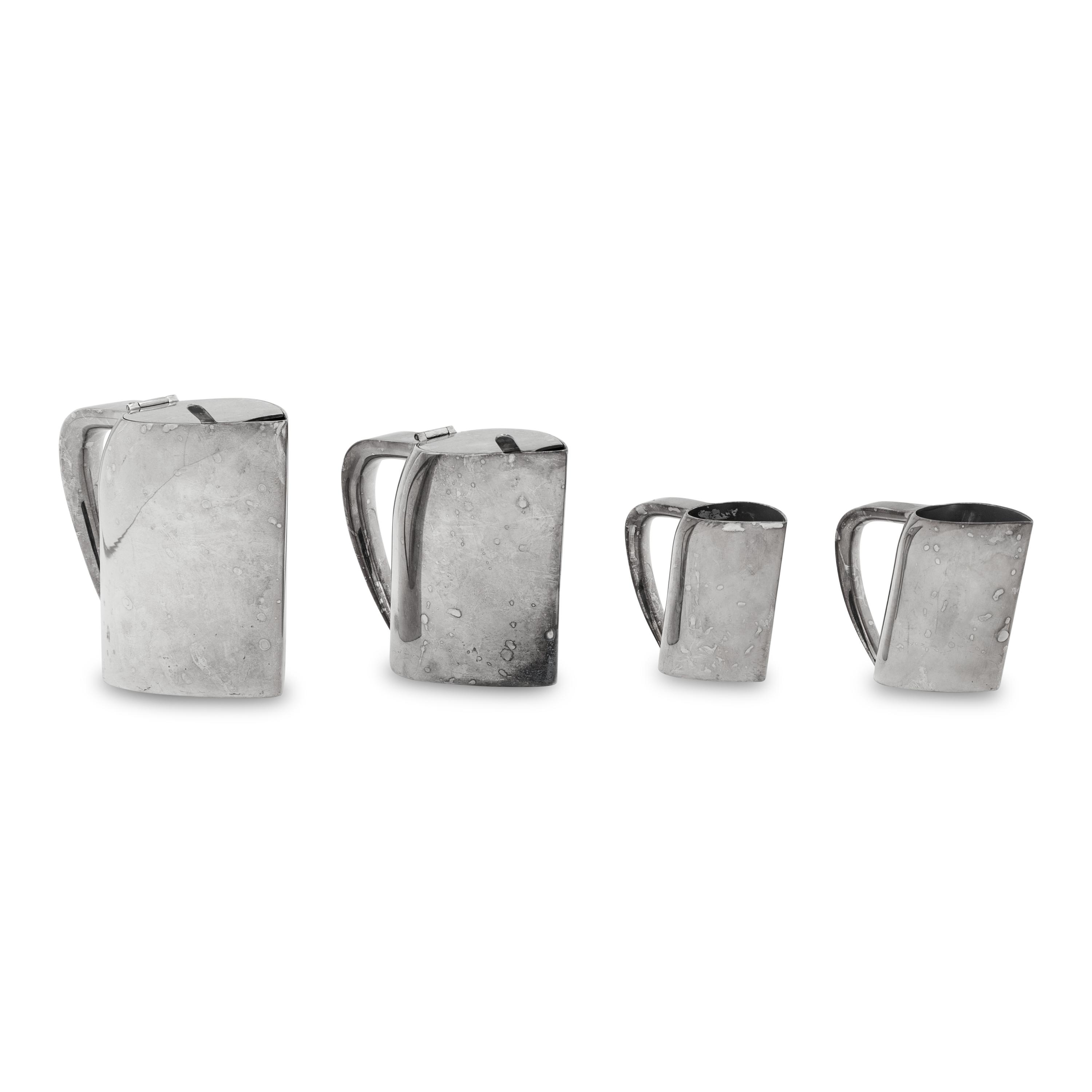 A Group of Four Ercuis Silver-Plate Milk or Cream Pitchers
