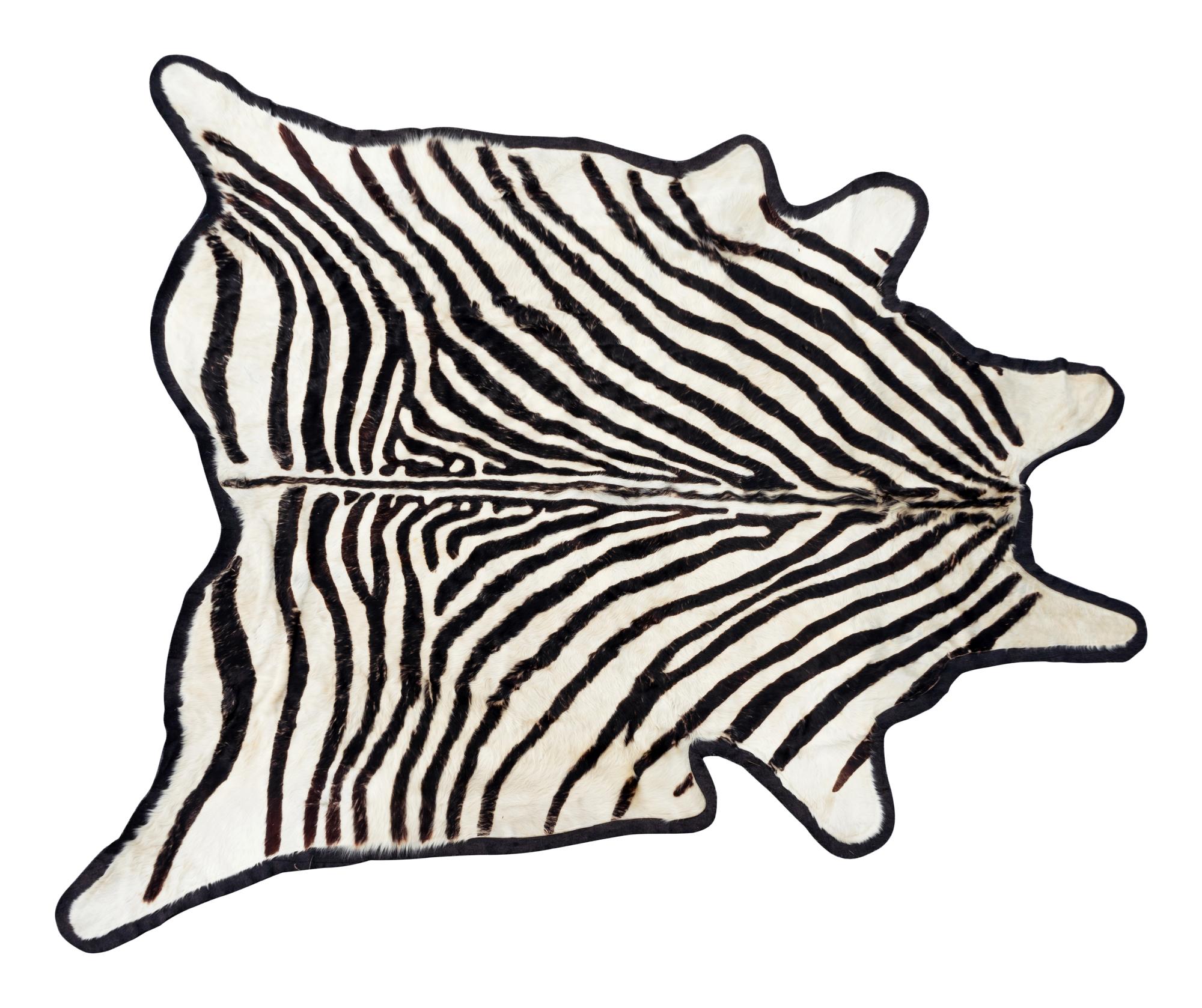A Zebra Design Cow Hide Rug — 20TH CENTURY