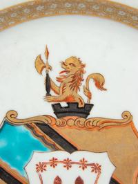 A Chinese Export Porcelain Parcel-Gilt Armorial Plate