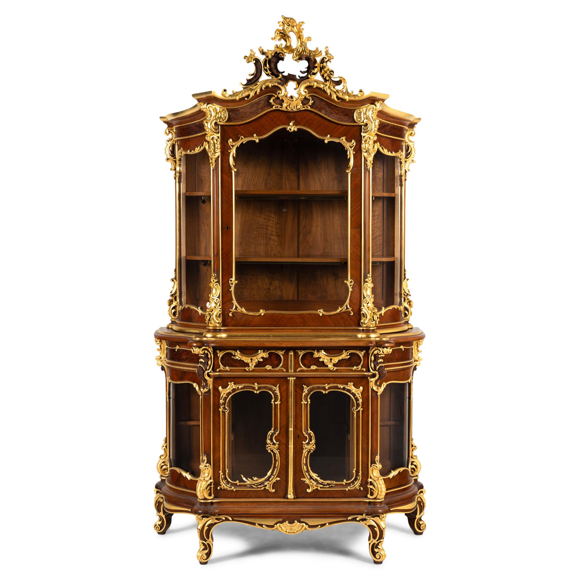 A Louis XV Style Parcel Gilt Mahogany Cabinet à Deux Corps
