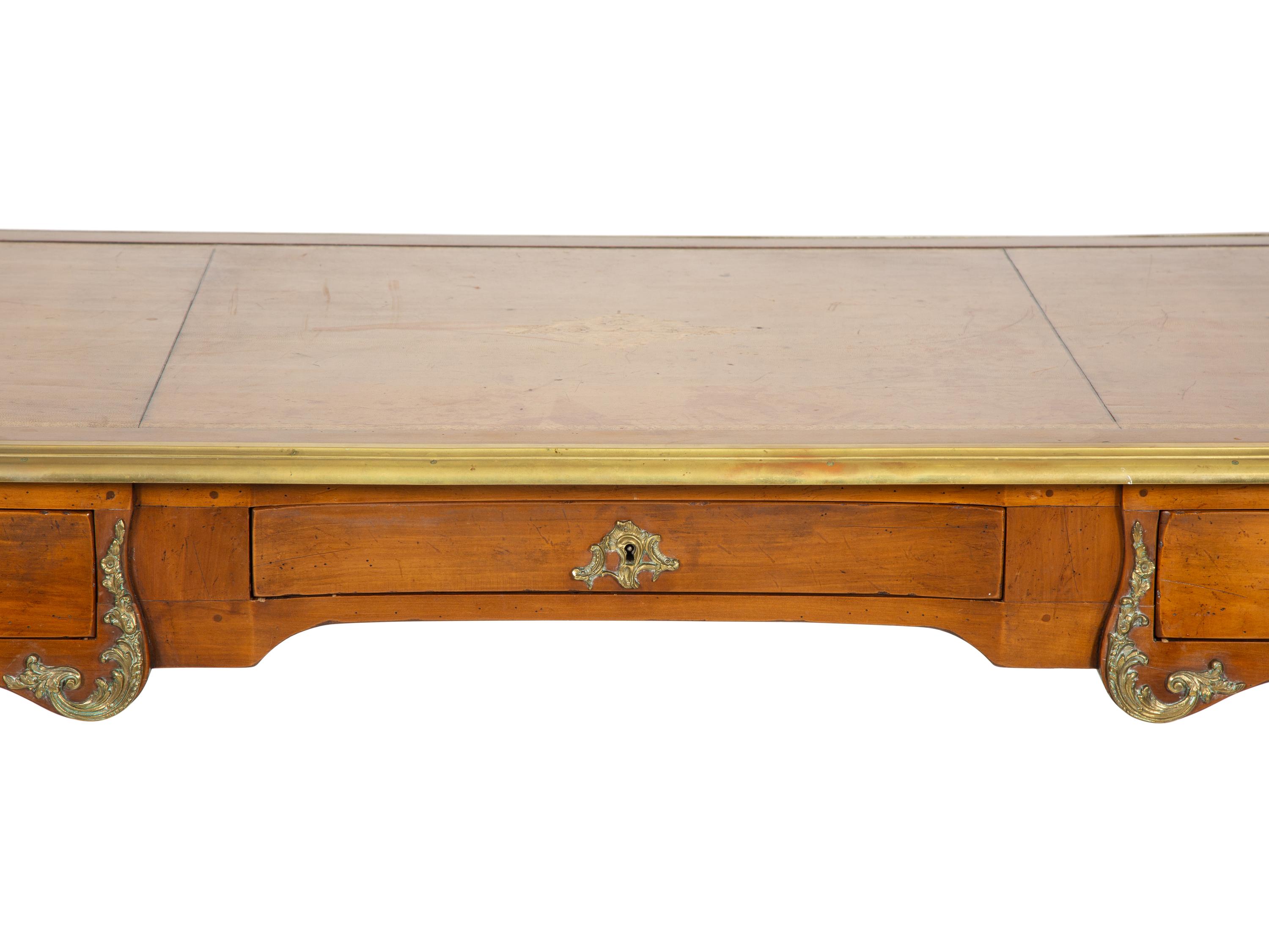 A Louis XV Style Gilt Metal-Mounted Fruitwood Bureau Plat