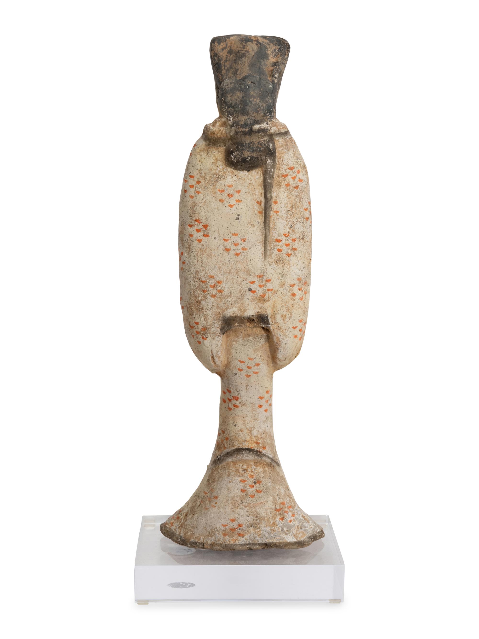 A Chinese Pottery Figure of a Female Attendant