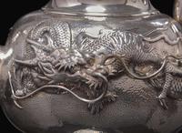 An impressive Japanese export silver four-piece "Dragon" tea and coffee service with tray, retailed by Arthur & Bond, Yokohama, late 19th/early 20th century 日式銀質咖啡器茶具四件及托盤 十九世紀末或二十世紀初