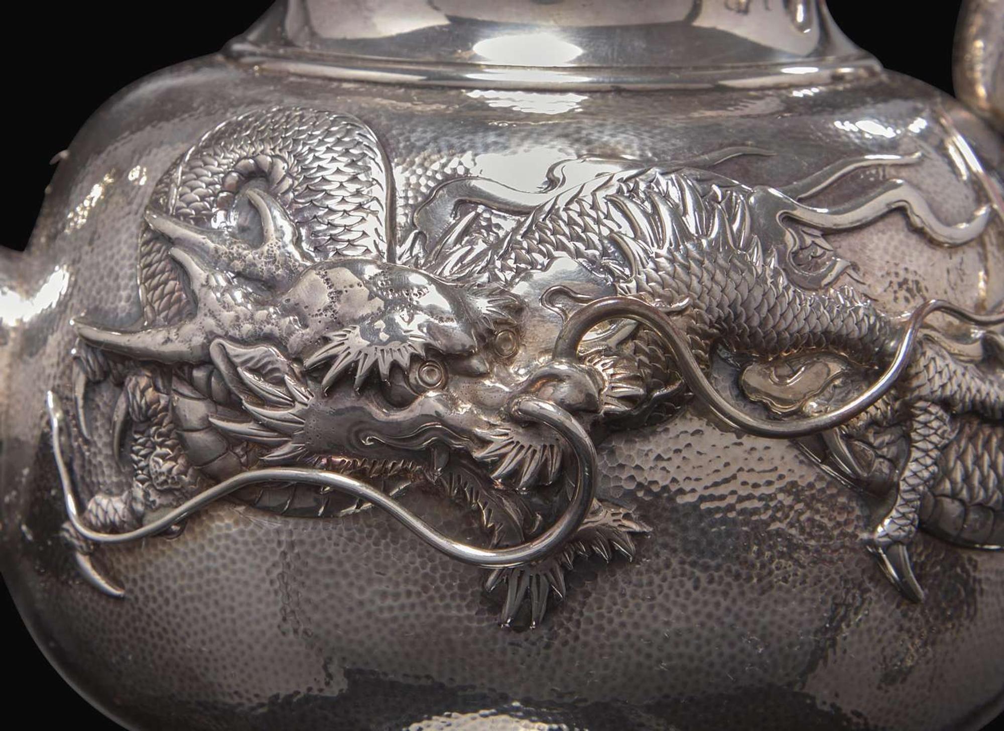 An impressive Japanese export silver four-piece "Dragon" tea and coffee service with tray, retailed by Arthur & Bond, Yokohama, late 19th/early 20th century 日式銀質咖啡器茶具四件及托盤 十九世紀末或二十世紀初