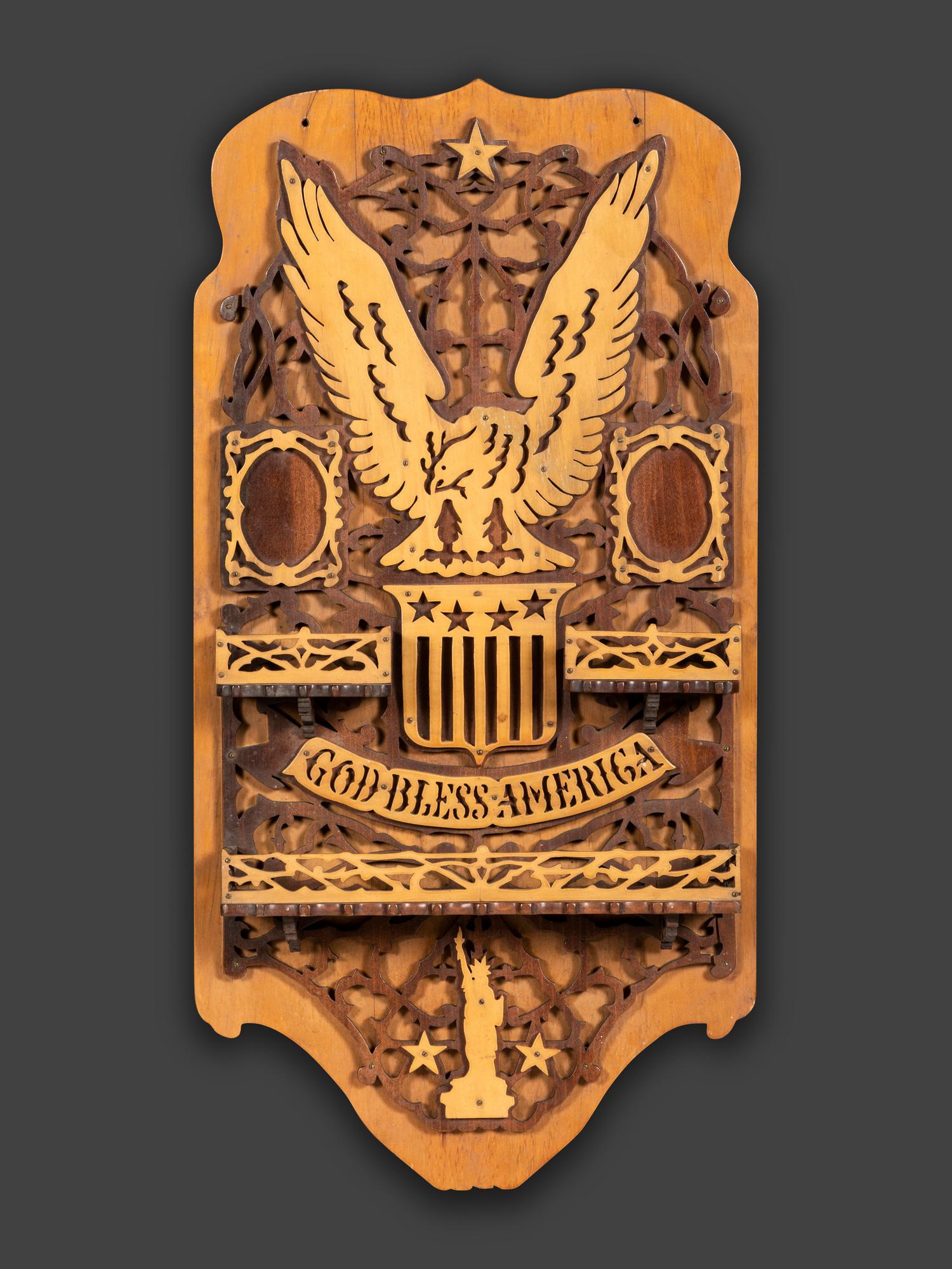 A Patriotic Fretwork Carved Wall Shelf and Frame