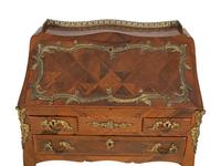 A Louis XV Style Parquetry Inlaid Writing Desk with Brass Gallery