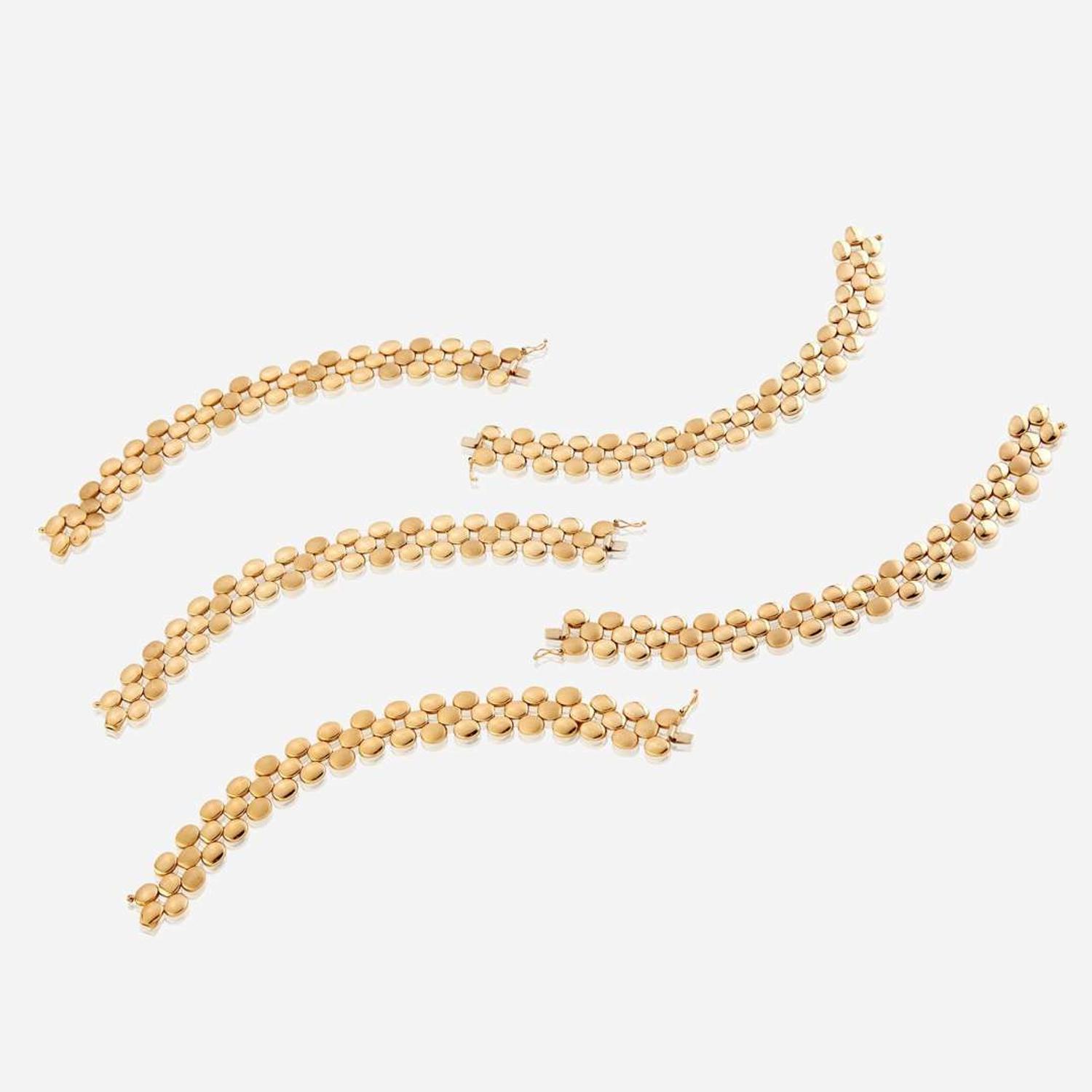 A collection of five fourteen karat gold bracelets