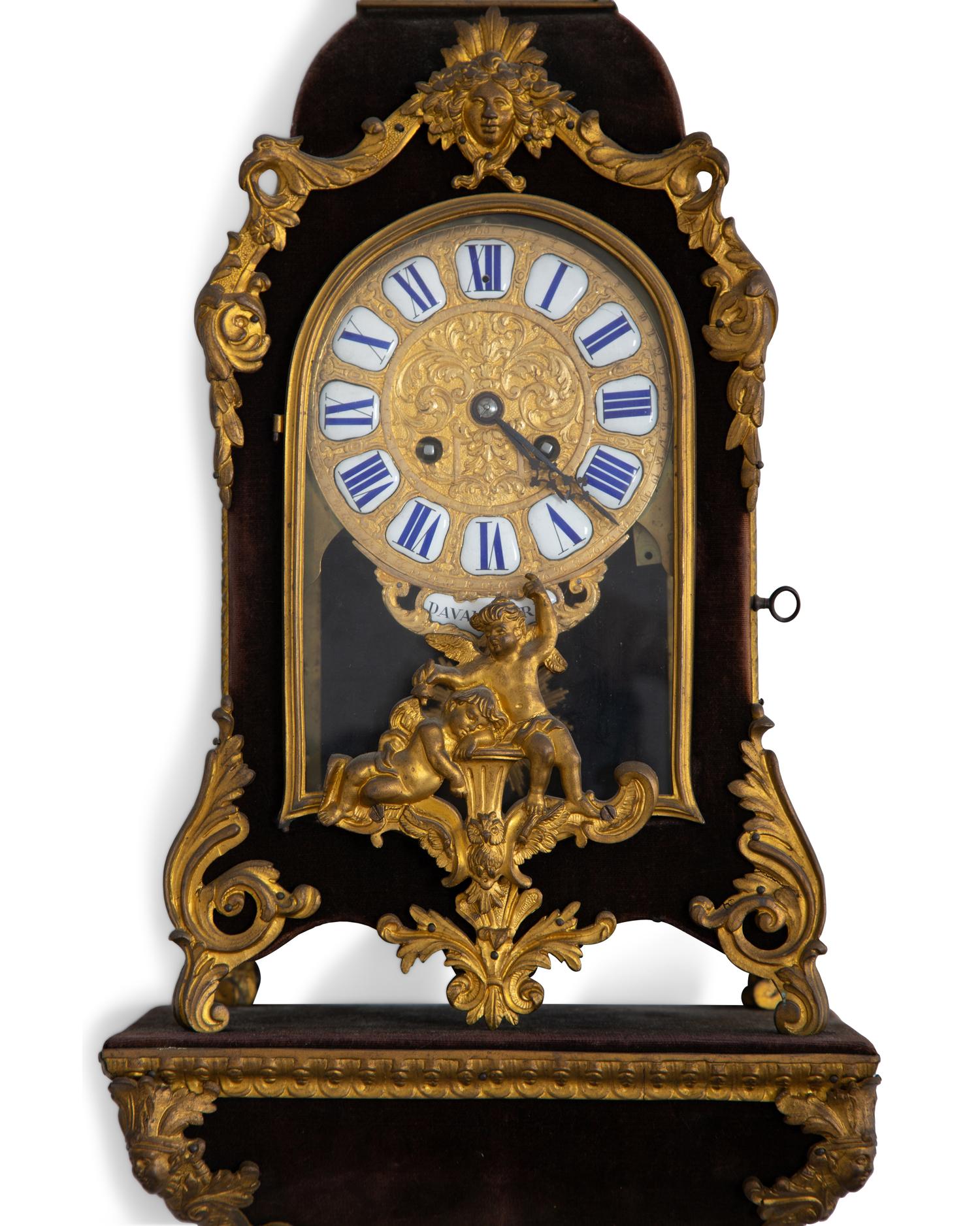 A Louis XV Style Gilt Bronze and Velvet Bracket Clock