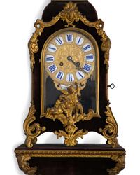 A Louis XV Style Gilt Bronze and Velvet Bracket Clock