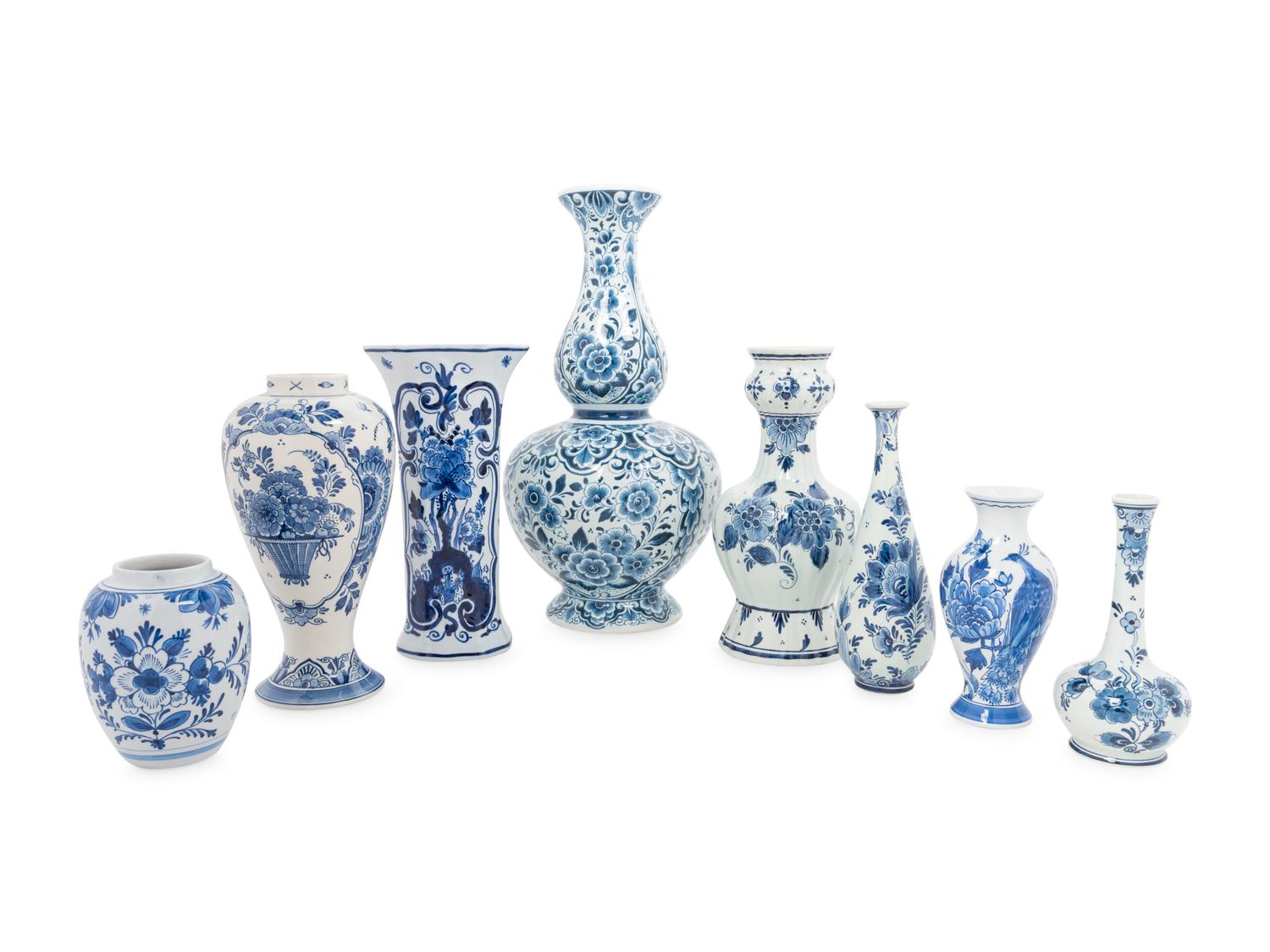 A Group of Eight Blue and White Earthenware Vases, Primarily Delft