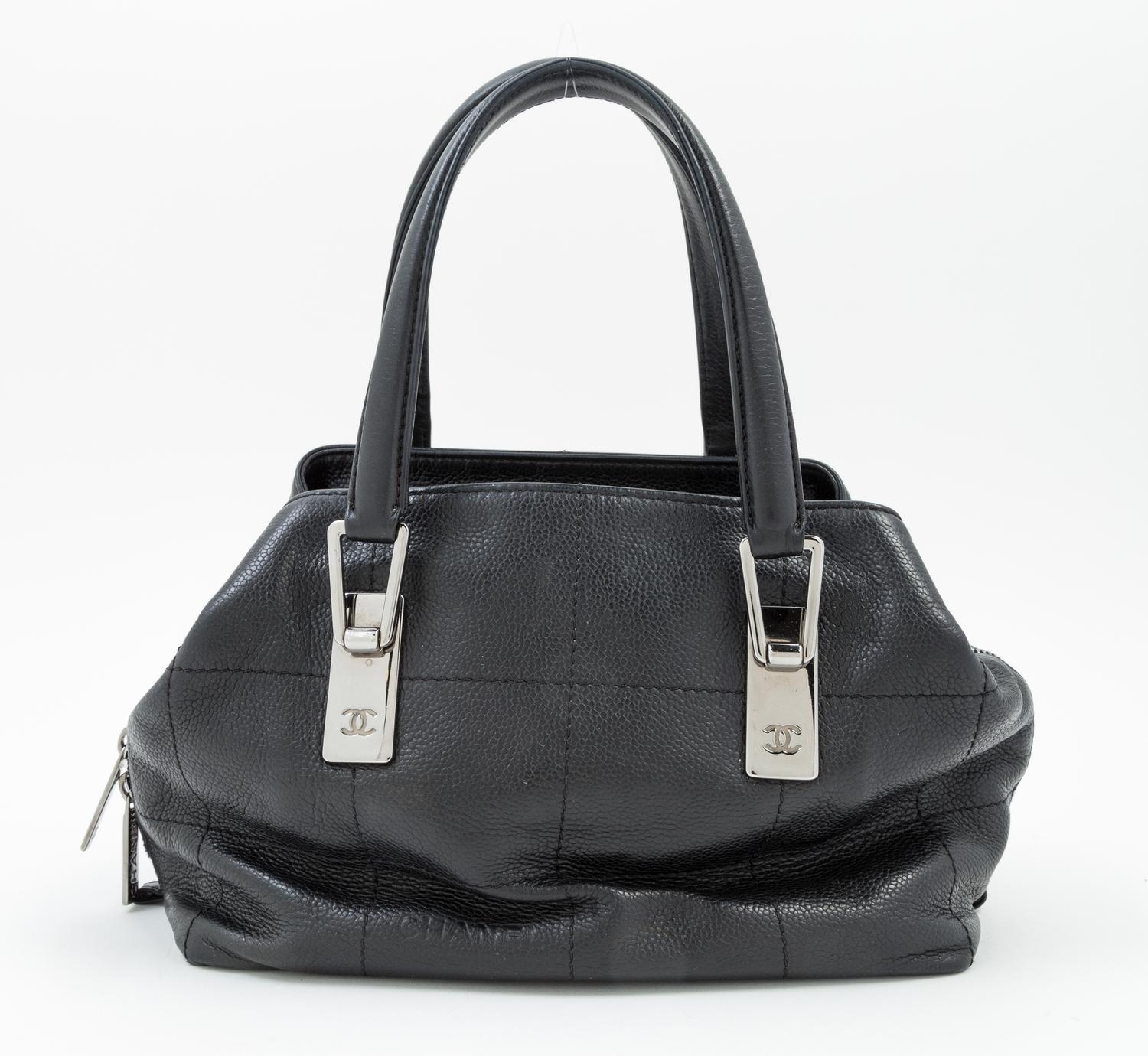 A Chanel Black Leather Handbag, 9.5" x 7" 5"; Handle drop: 5.5".