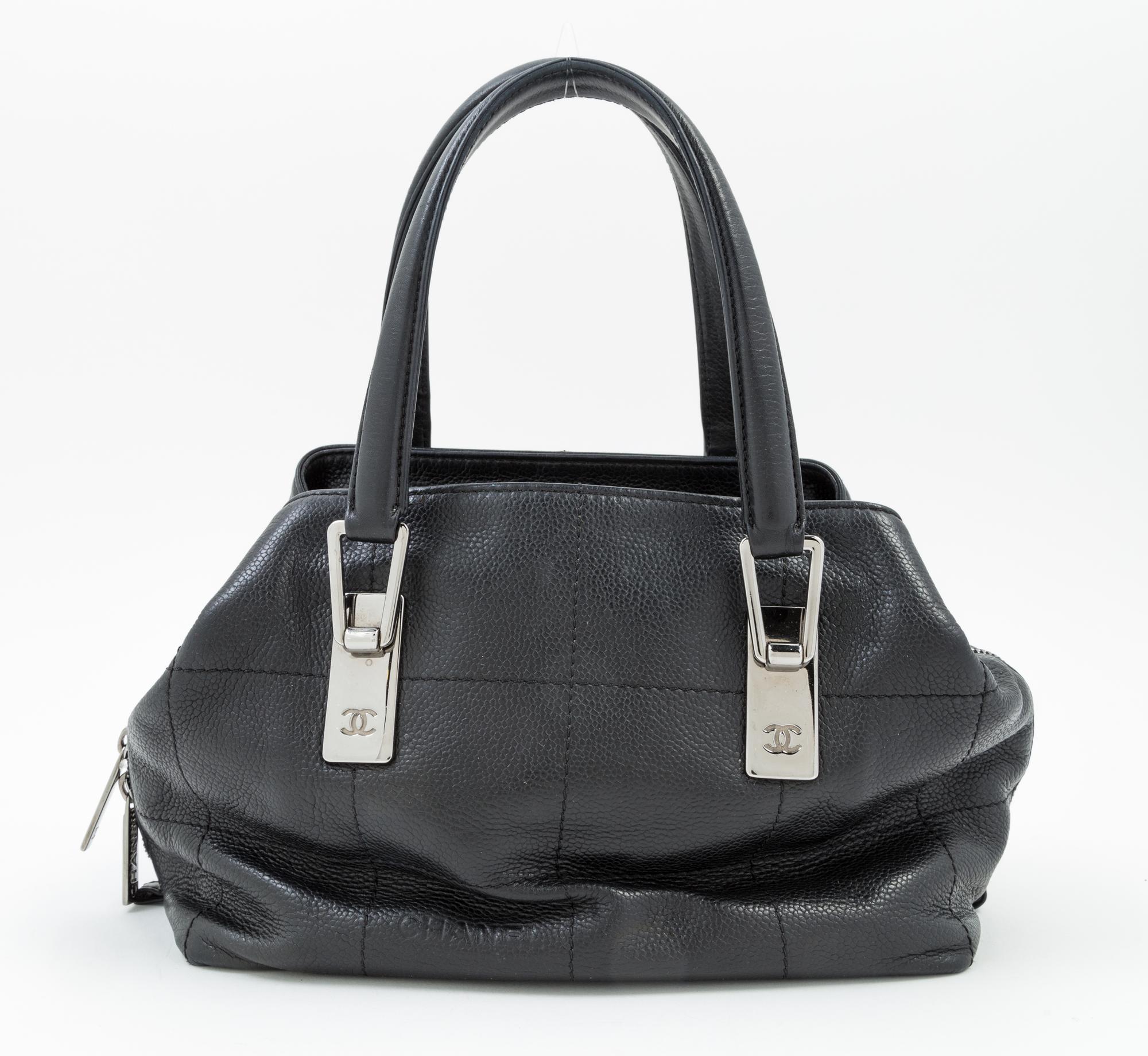 A Chanel Black Leather Handbag, 9.5" x 7" 5"; Handle drop: 5.5".
