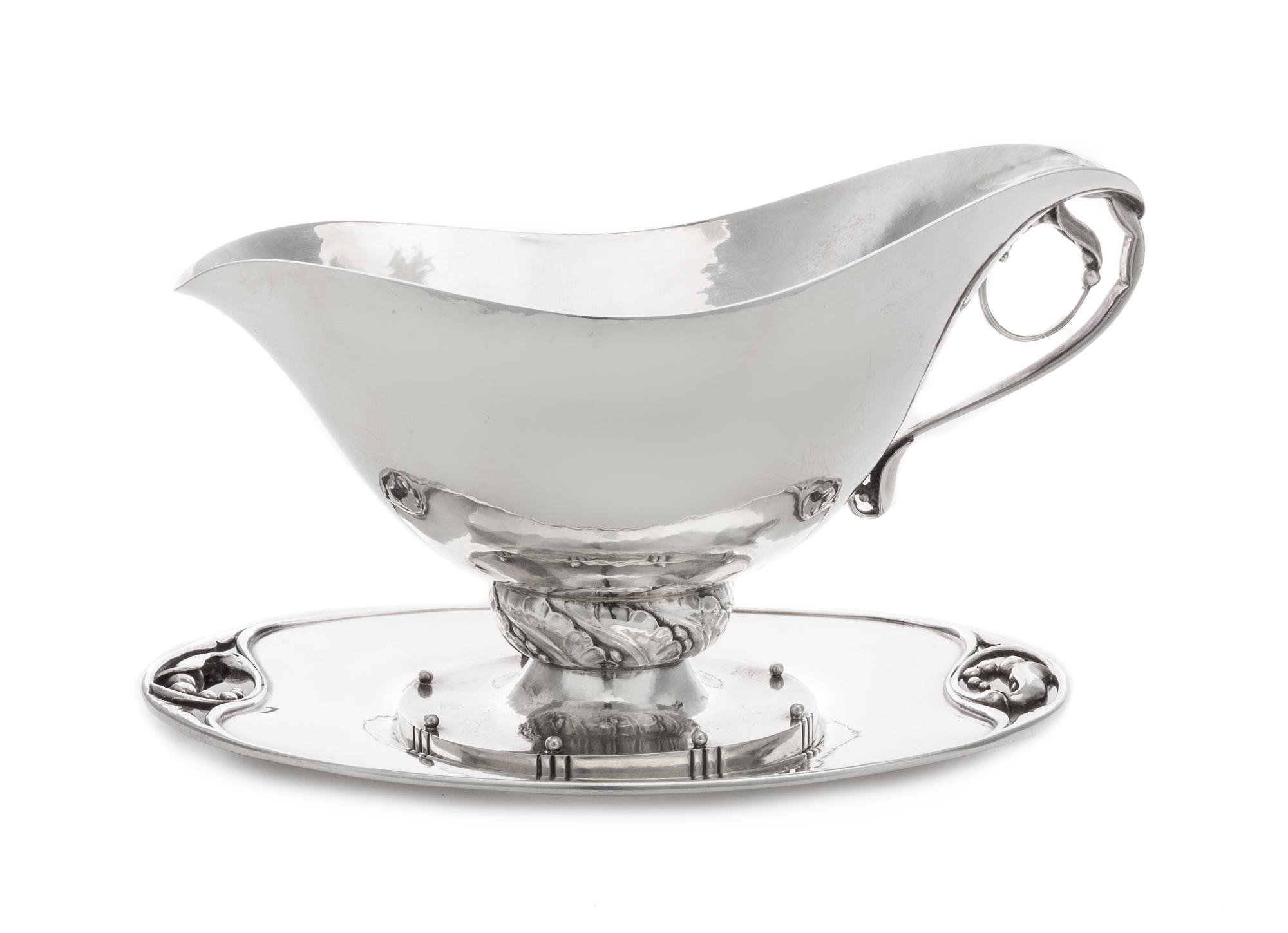 A Danish Silver Sauce Boat and Underplate, Georg Jensen Silversmithy, Copenhagen, First Half 20th Century, the boat marked with pattern