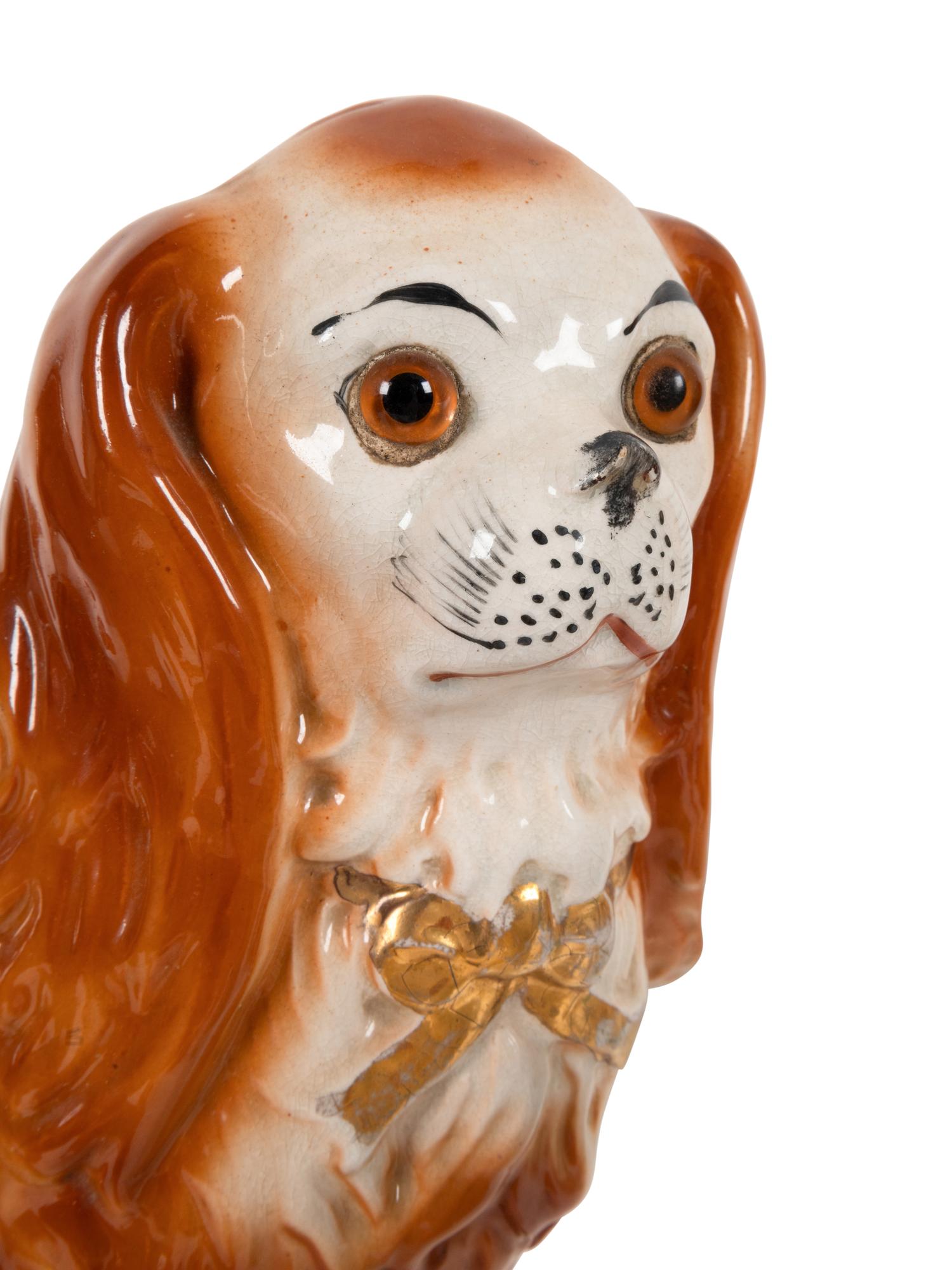 A Group of Staffordshire Porcelain and Pottery Models of Dogs