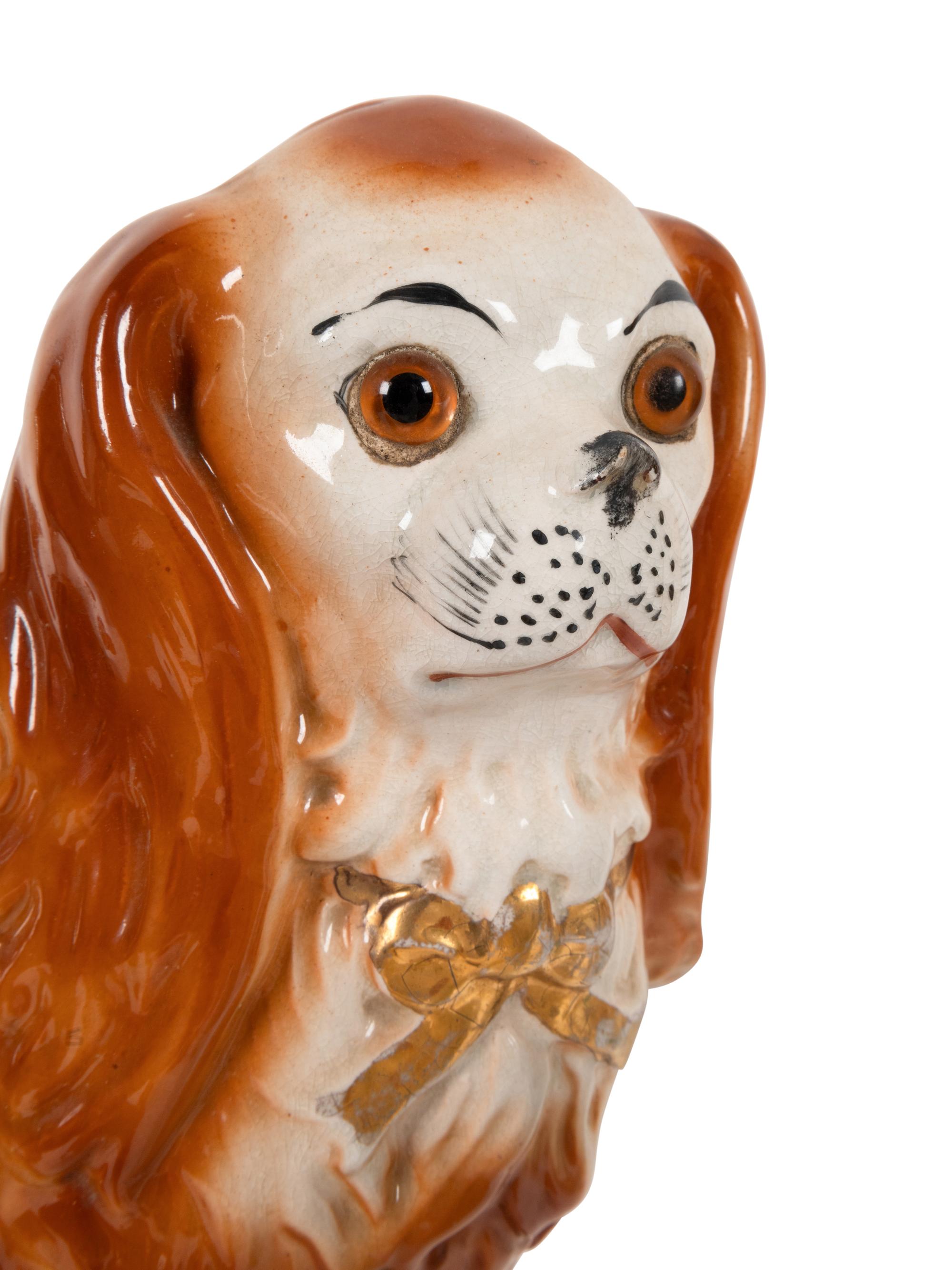 A Group of Staffordshire Porcelain and Pottery Models of Dogs