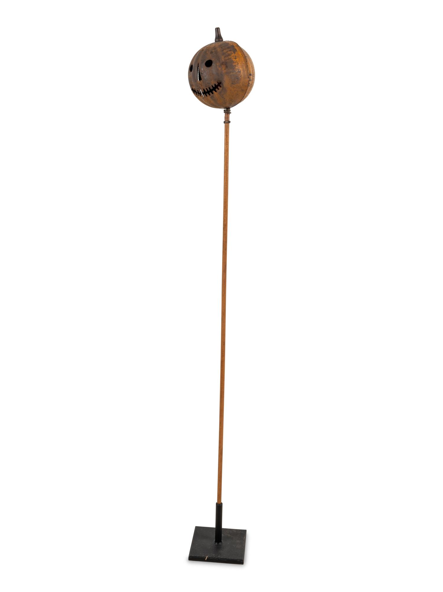 A Painted Tin Jack O' Lantern Ornament