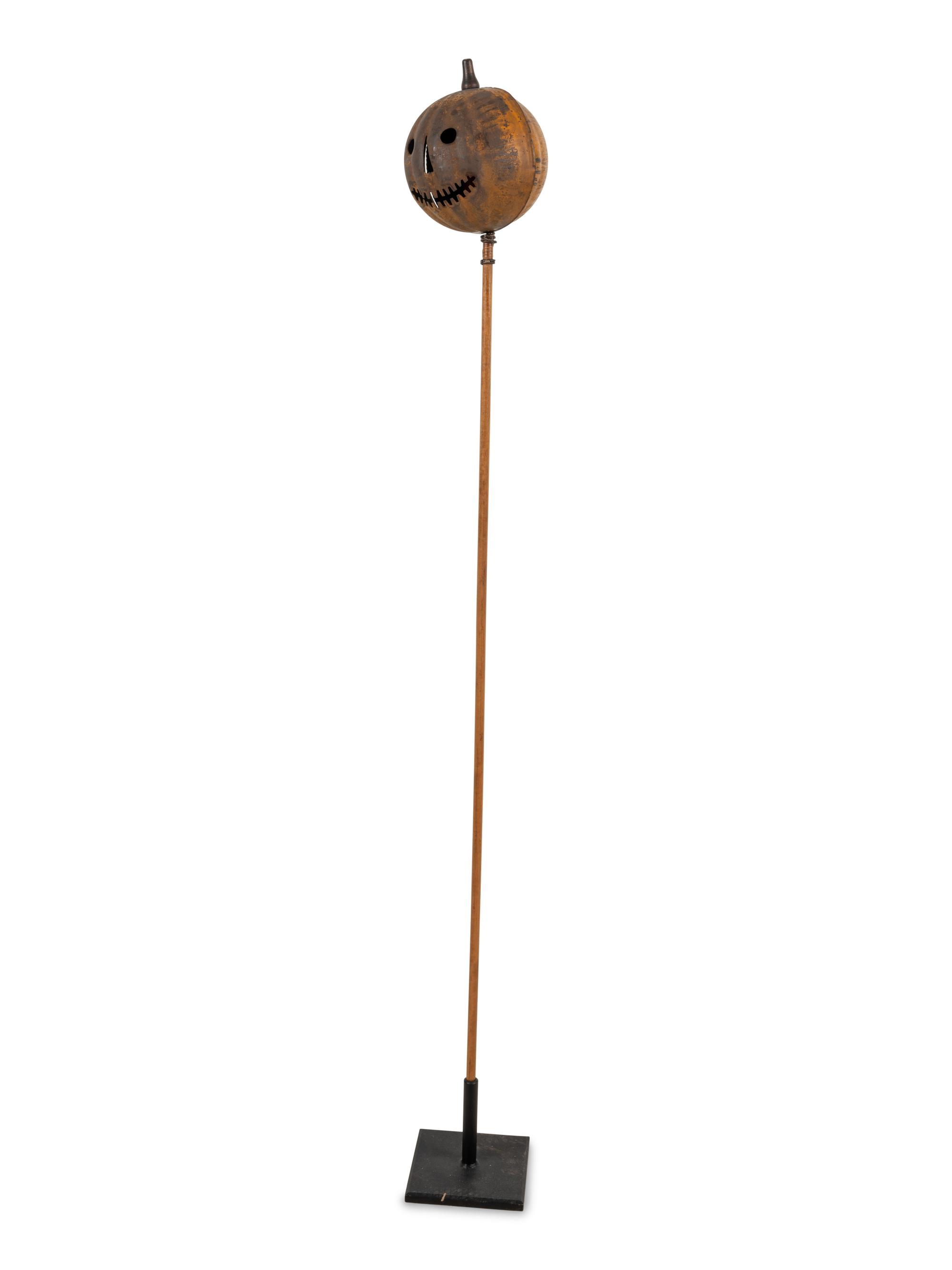 A Painted Tin Jack O' Lantern Ornament