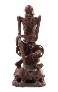 A Carved Rosewood Figure of an Immortal Height 10 1/2 inches.
