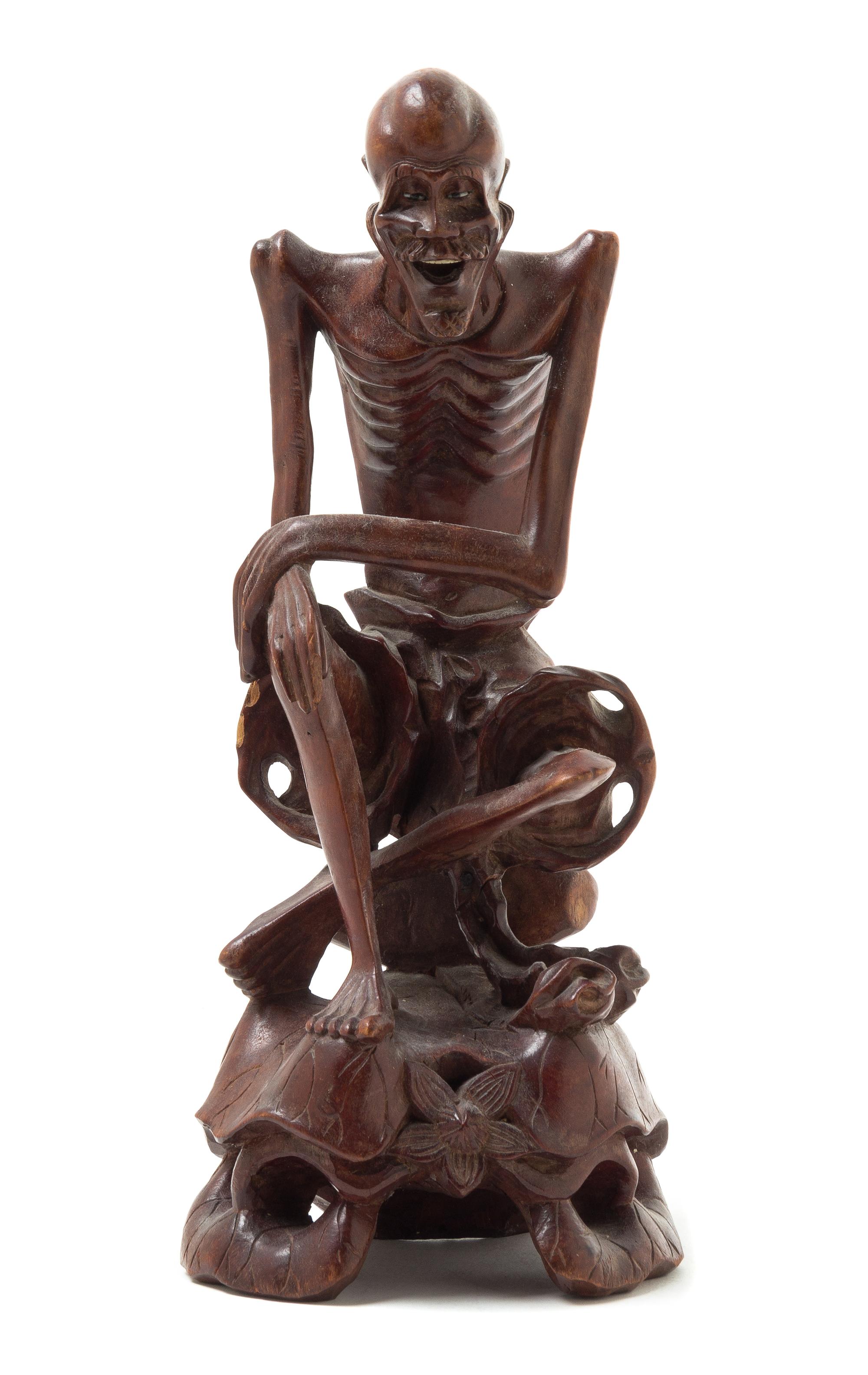 A Carved Rosewood Figure of an Immortal Height 10 1/2 inches.