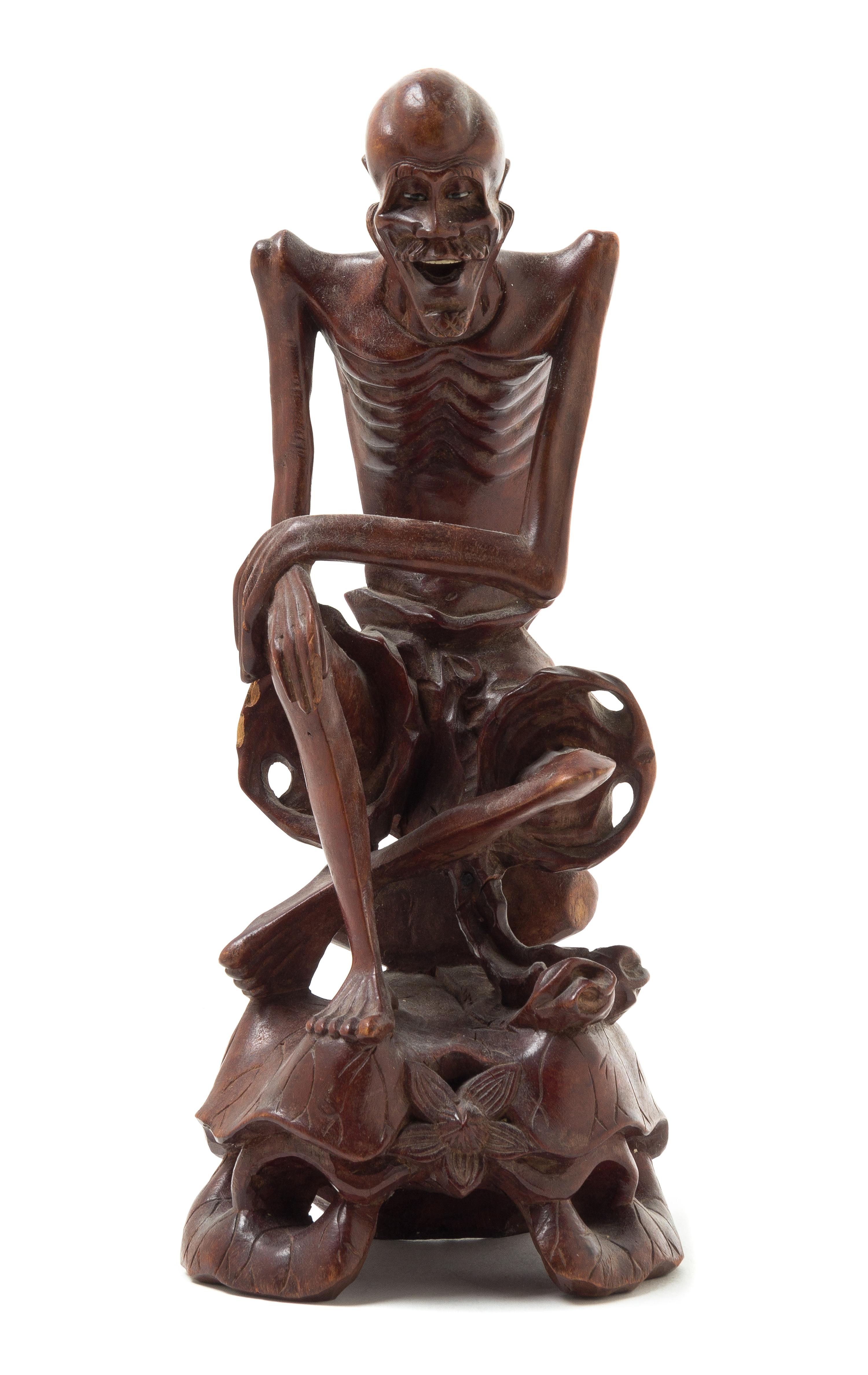 A Carved Rosewood Figure of an Immortal Height 10 1/2 inches.