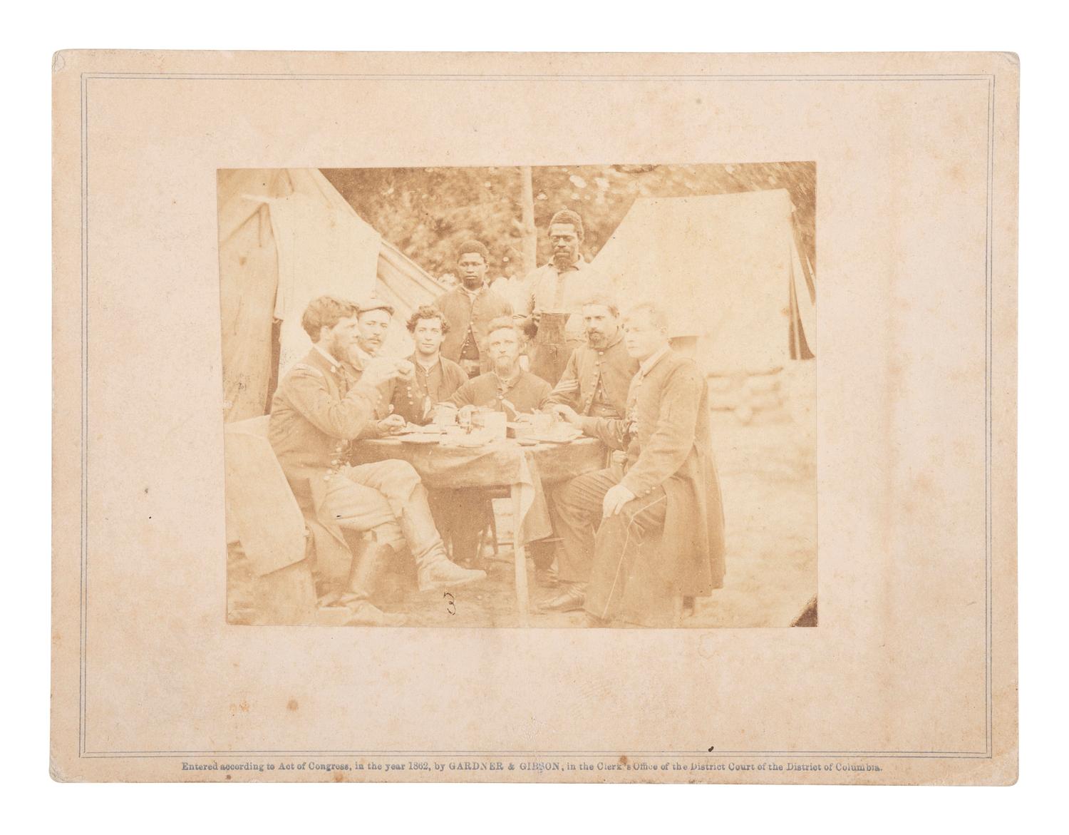 [CIVIL WAR]. GARDNER & GIBSON, photographers. Photograph of Civil War soldiers with African American servers. Washington, DC: 1862.