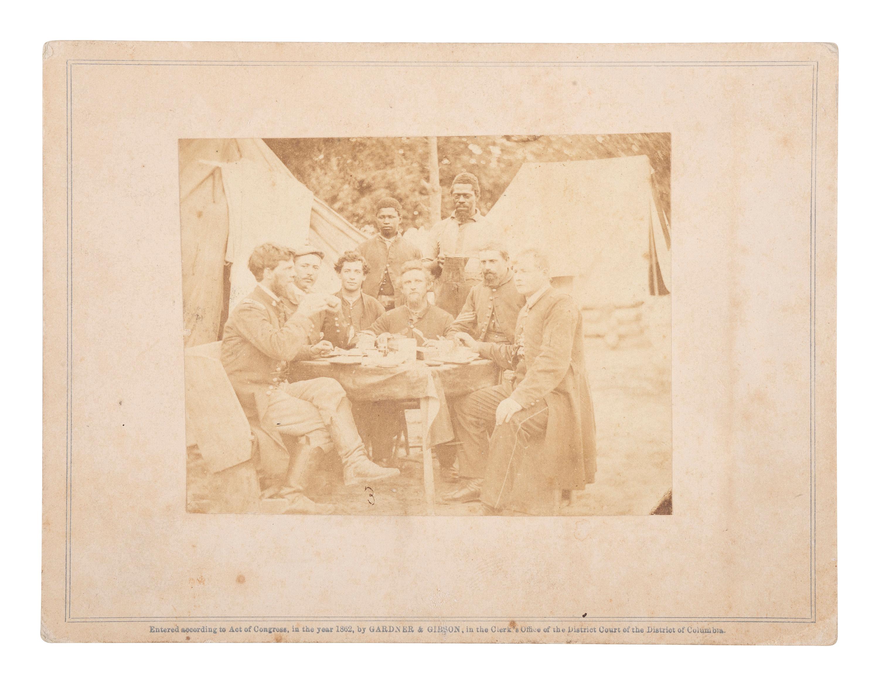 [CIVIL WAR]. GARDNER & GIBSON, photographers. Photograph of Civil War soldiers with African American servers. Washington, DC: 1862.