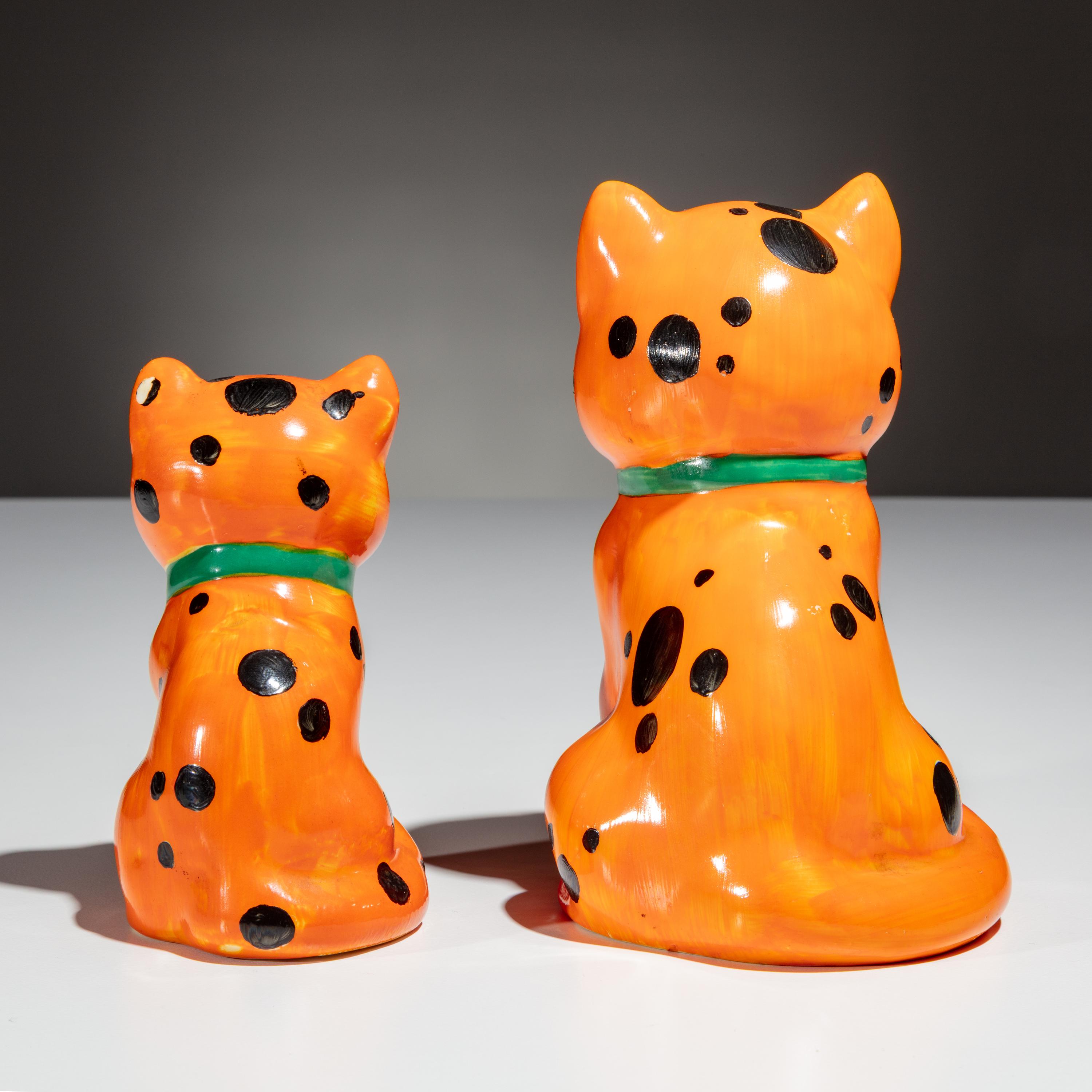 Clarice Cliff (English, 1899–1972) — Two Orange Laughing Cat Figures