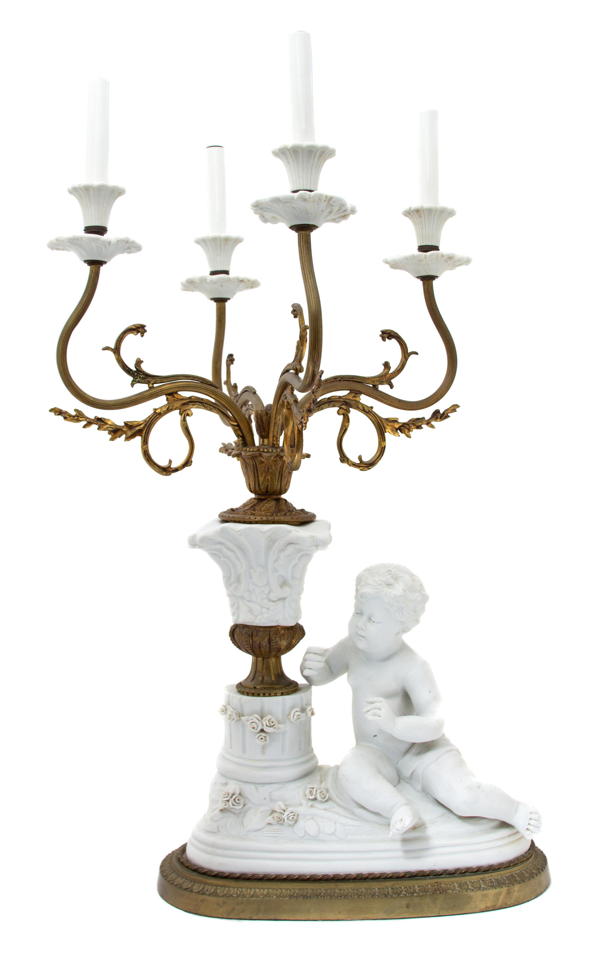 A Continental Bisque Mounted Gilt Bronze Four-Light Candelabrum Height to bulb 29 x width 14 x depth 14 inches. — LATE 19TH/EARLY 20TH CENTURY