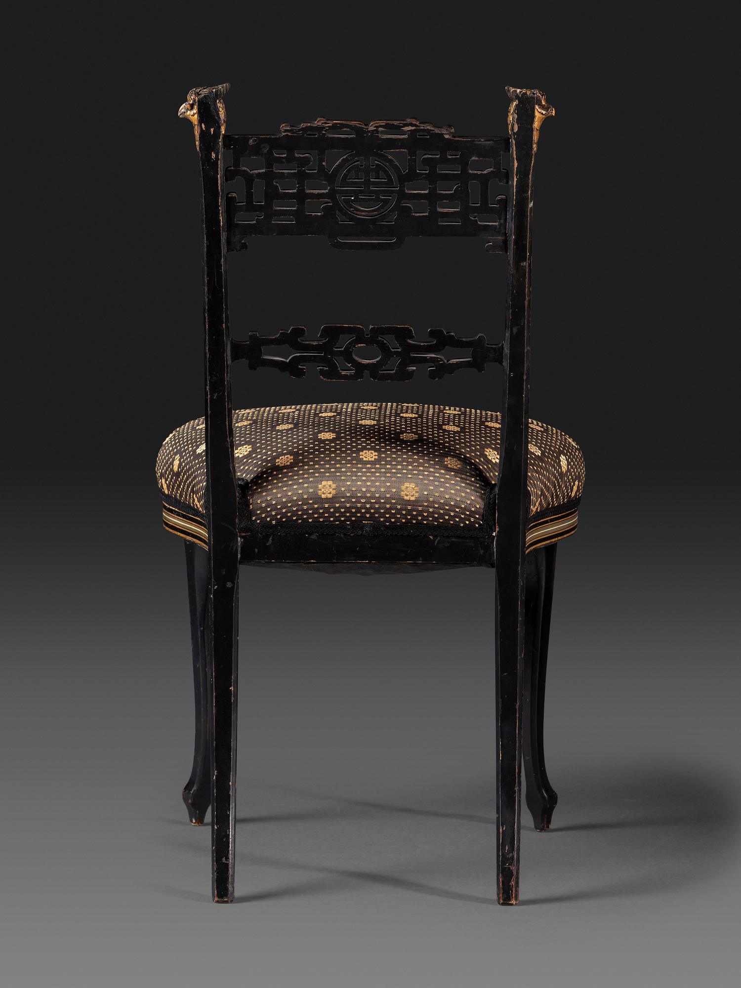 An Aesthetic Movement Painted, Parcel Gilt and Ebonized Bird-Carved Side Chair
