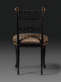 An Aesthetic Movement Painted, Parcel Gilt and Ebonized Bird-Carved Side Chair