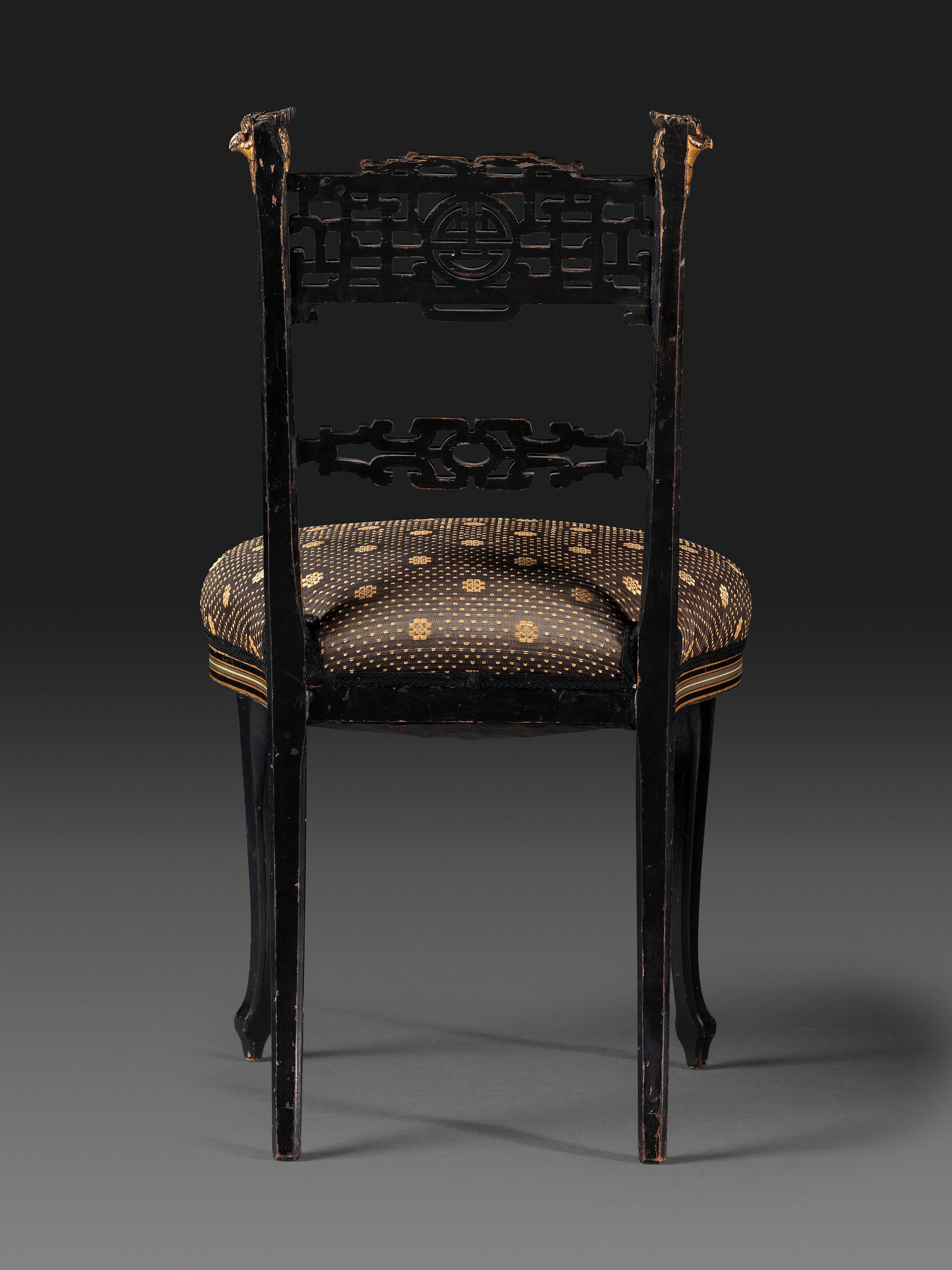 An Aesthetic Movement Painted, Parcel Gilt and Ebonized Bird-Carved Side Chair