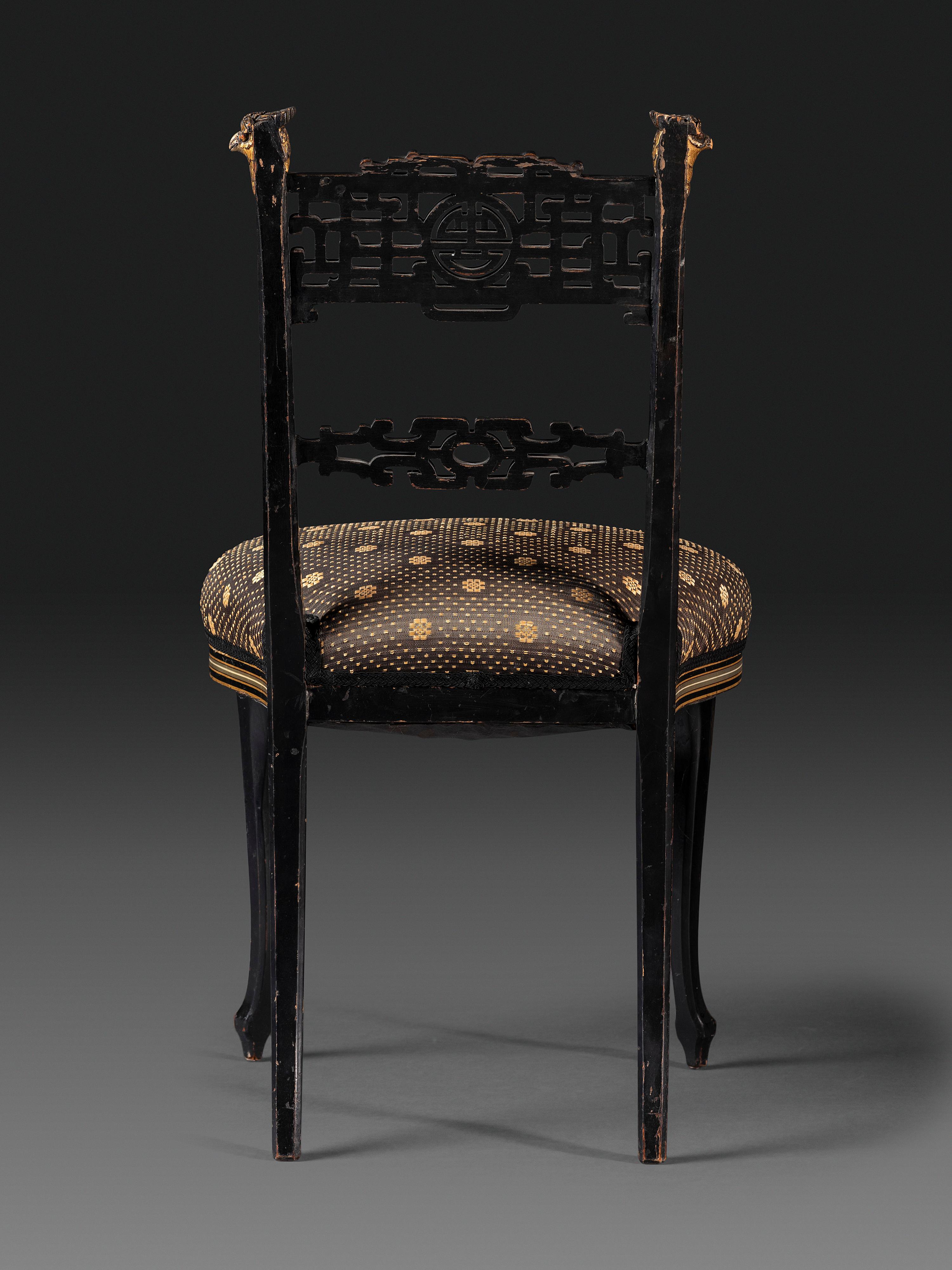An Aesthetic Movement Painted, Parcel Gilt and Ebonized Bird-Carved Side Chair