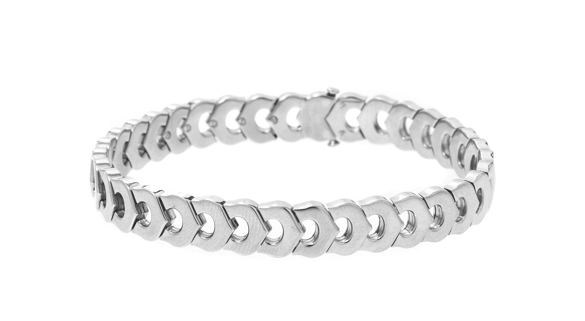An 18 Karat White Gold Signature Demi Parure, Cartier, 81.00 dwts.
