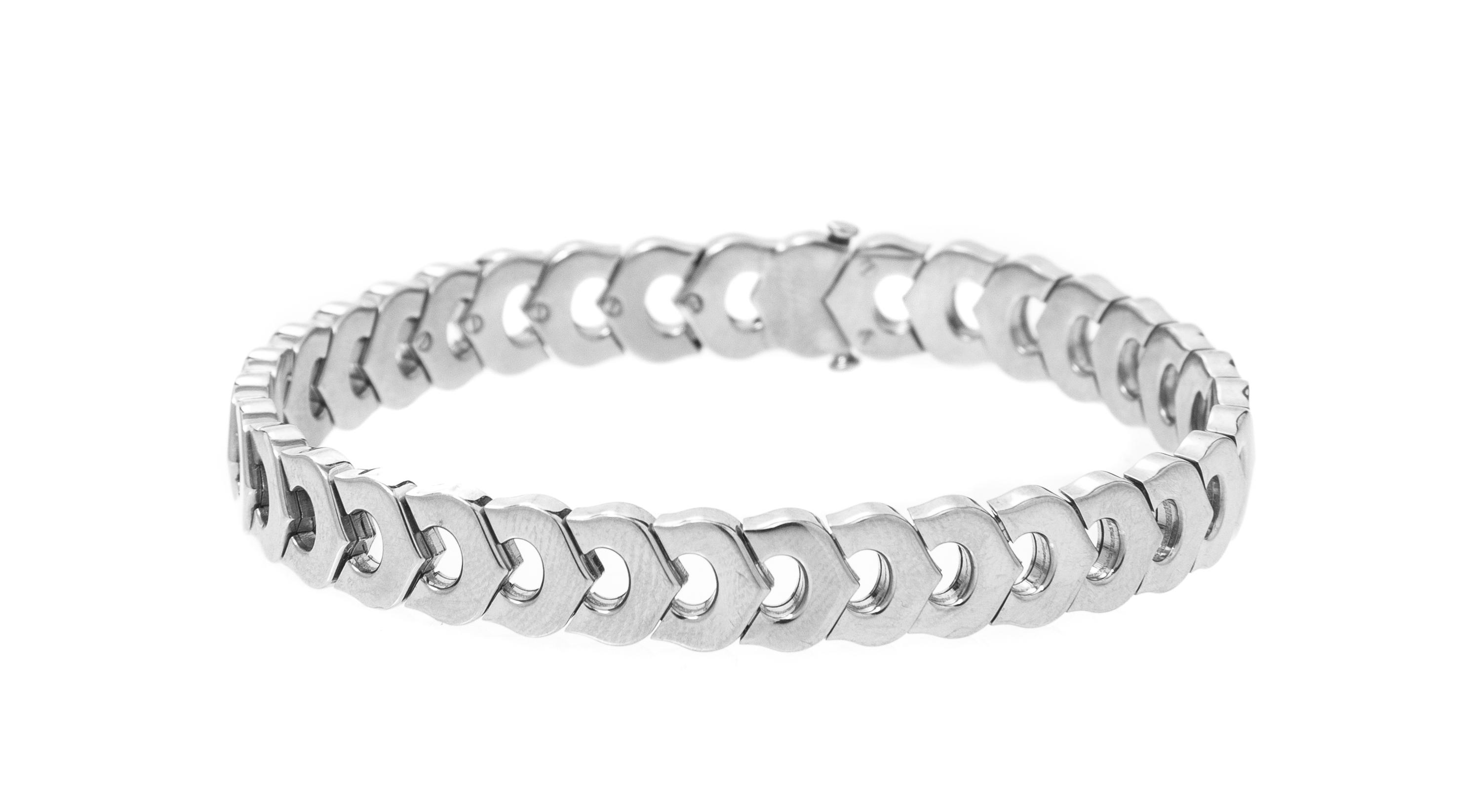 An 18 Karat White Gold Signature Demi Parure, Cartier, 81.00 dwts.
